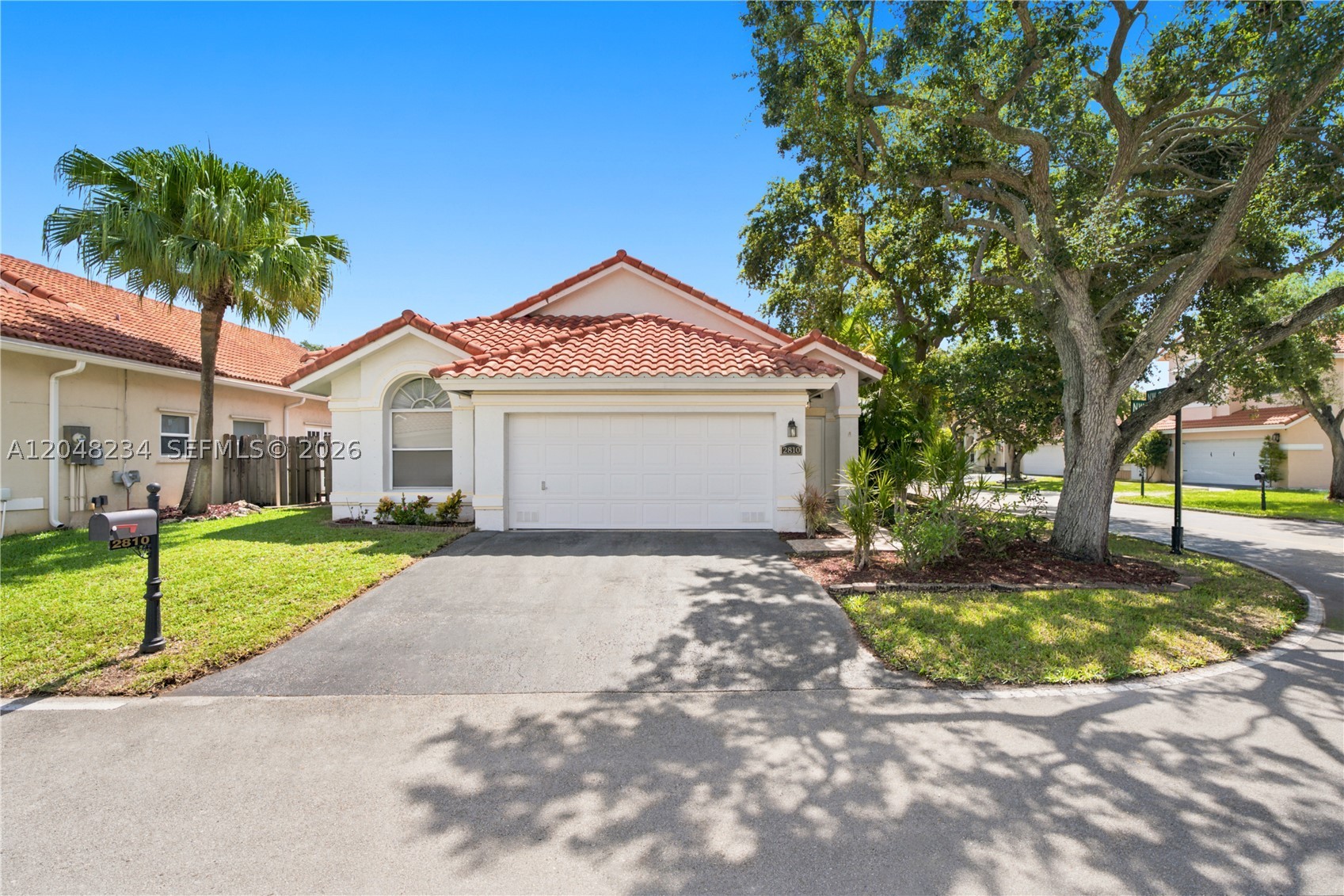 A distinguished corner-lot residence in Coral Lakes Estates, this impeccably maintained home blends modern updates with timeless sophistication. The 2016 roof and newer washer/dryer & water heater complement a beautifully renovated interior featuring an upscale kitchen and renovated bathrooms appointed with stainless-steel appliances, Decolav and Kohler fixtures, and dual sinks in the primary suite. Dramatic 18-ft vaulted ceilings elevate the living space, while the kitchen’s eat-in area offers an inviting everyday retreat. A screened-in patio creates an elegant setting for indoor-outdoor entertaining, and the spacious 2-car garage enhances convenience. Set within a desirable community known for its low maintenance fees, this residence delivers refined living and enduring value.