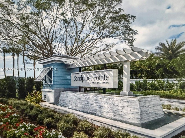 PRICED to SELL. New 2022. A Luxury builder Toll Brothers' privileged townhouse on a double premium CORNER and LAKEFRONT lot. There are just 5 privileged WESTWIND model of 1930 Sqf CORNER and LAKEFRONT in the whole community of 201 townhouses and this is the only one for Sale. 3 bedrooms/2.5 baths, 2-car covered garage, 2-car driveway, 9.5" ceilings, high impact windows and doors. Quartz countertops in the kitchen, large island, white cabinetry, stainless steel appliances. Upper floor with large LOFT, split-bedroom plan, spacious laundry room. Upgraded porcelain floor. Beautiful wooden Stairs. Some Electrical blinds on windows. Sandpiper Pointe is a modern luxury gated community with pool, fitness center, playground, low HOA, pet-friendly, rental-friendly, investor-friendly with high ROI, it could be rented right away. And last but not least situated at 2.2 miles of one of the BEST beaches of FL. Deerfield Beach is an award -winning "Blue Wave" beach with spectacular-pristine waters, 5 miles of white sand beach with excellent restaurants, and the iconic 976-foot International Fishing Pier offering fishing, walking, scenic views, activities. Offshore reefs help calm the surf, making a relaxing coastal destination. Notable movies like Baywatch (2017, TV series), In her Shoes(2005) and Rock of Ages (2012) have been filmed in Deerfield Beach, FL.
