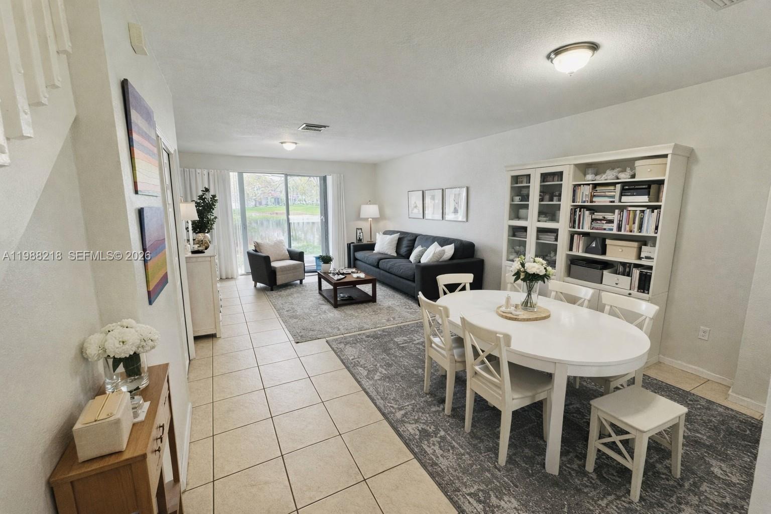 SELLER MOTIVATED. Enjoy serene waterfront living in this spacious 3-bedroom, 2.5-bathroom townhouse located in the sought-after Tuscany community. This two-story residence features a bright, open layout with a mix of ceramic and vinyl flooring throughout. The functional kitchen comes fully equipped with a dishwasher, microwave, refrigerator, and a pantry for extra storage. Waterfront Views: Beautiful pond-front location offering peaceful views.Spacious Layout: 1,306 sq. ft. of living area with all bedrooms located upstairs for maximum privacy. In-unit washer and dryer included, along with two assigned parking spaces. Central cooling and a heat pump. Residents of Tuscany at New Renaissance  enjoy access to a fenced complex featuring a clubhouse, sparkling pool, and tennis courts. Ideally situated near Fairway Elementary and Miramar High School. INVESTOR FRIENDLY: rented @ $2,550/M until 12/16/2026. SPECIAL SELLER INCENTIVE: Seller is open to contributing toward a rate buydown or closing costs with a strong offer. Don't wait, bring your offer and LET'S NEGOTIATE.