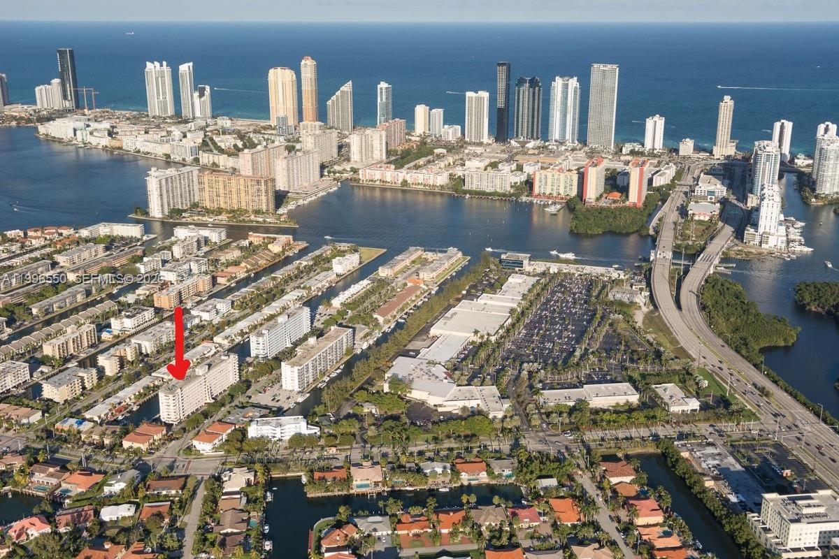Waterfront condo in the beautiful, gated community of Eastern Shores. This one bedroom one bathroom offers 828 square feet of living space. Open balcony overlooking the canal. It has been very well maintained. The seller prefers to sell turnkey (furnished). Windows protected with hurricane shutters. Community has heated pool, clubhouse, and barbecue area. It is a 15-minute walk to the beach and 5- minute walk to shopping, numerous restaurants, and movie theater. Building has its 50-year certification and also has reserves. Current special assessment will be paid by seller.