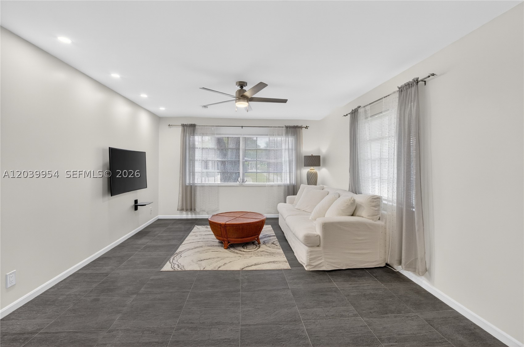 Low-maintenance 2-bed, 2-bath villa in a sought-after 55+ pet-friendly community. monthly association fees covering water, sewer, trash, basic cable, exterior maintenance, and roof care. Wide range of amenities 3 cooled/heated swimming pools, clubhouse, library, fitness center, billiards, shuffleboard, and bocce ball. Residents can also use tennis and pickleball courts. Conveniently located 12 min from the beach ()Gulfstream Park() with fr.park, shopping, dining, entertainment, major highways, airports, and just a short drive to the beach. Inside, the home features tile flooring throughout the main living areas, with water-resistant laminate in the bedrooms and enclosed patio. The main bathroom showcases elegant travertine finishes, and both bathrooms have been updated. The kitchen includes updated stainless steel appliances. New washer and dryer in the laundry room. Additional upgrades include a TRANE A/C system with a newer condenser, newer roof and water heater, fresh interior paint, and smooth ceilings for a modern look. Bright living spaces are filled with natural light, and the enclosed Florida room offers a flexible space for relaxing or hobbies. The property includes two assigned parking spaces and is within walking distance to both the main clubhouse pool and an additional pool. One small pet is permitted, completing this inviting South Florida home.