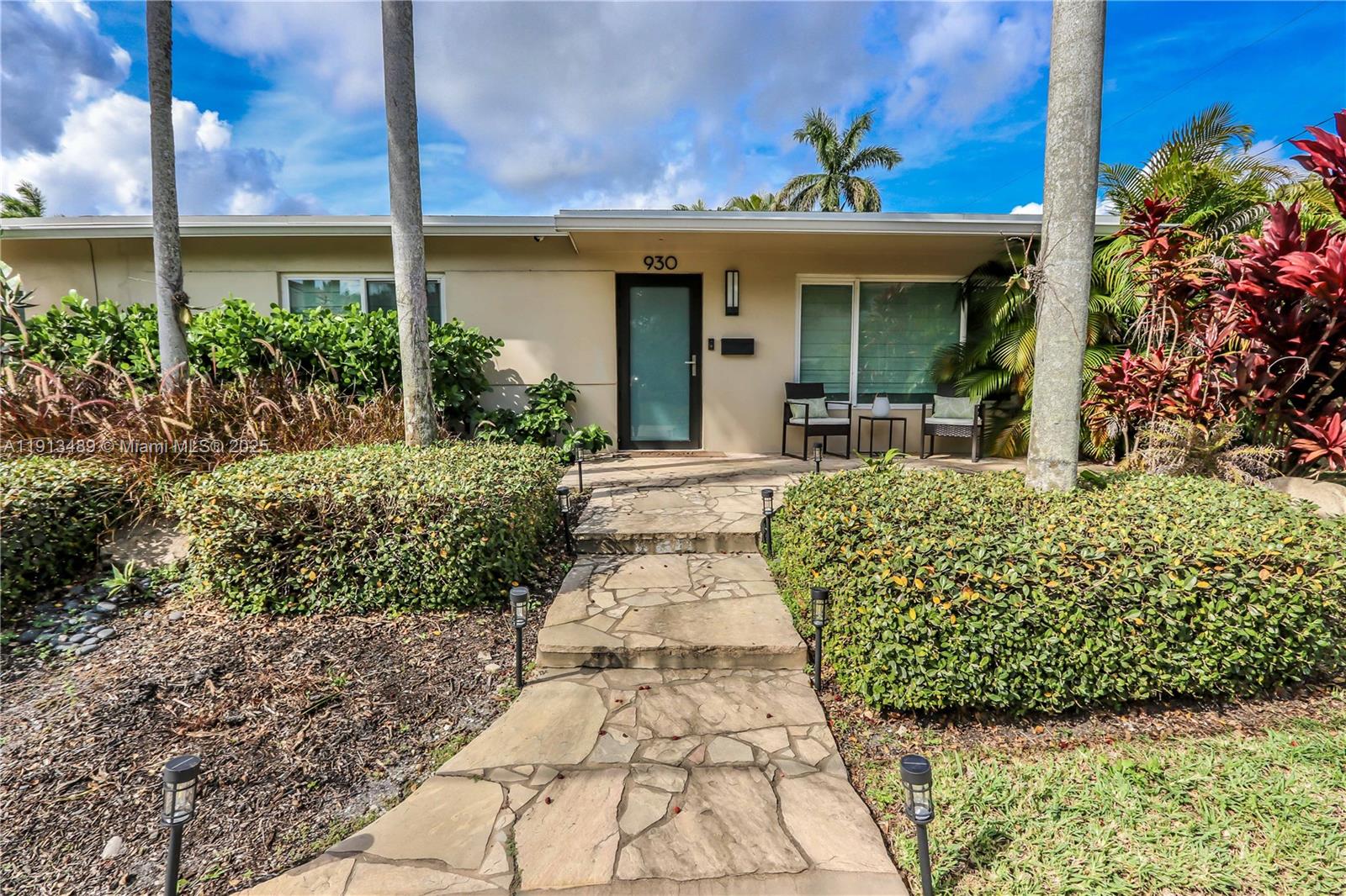 Step into timeless style and modern luxury with this beautiful 3 bed, 3 bath pool home just minutes from North Lake and the beach. This home has been meticulously maintained and thoughtfully upgraded through out the years, showcasing original terrazzo floors and an open floor plan perfect for entertaining. Enjoy a sleek newer kitchen with Italian two-tone cabinets, waterfall countertops, and stainless steel appliances. Featuring two primary en suites plus a guest bedroom and full bath, the layout is perfect for entertaining or hosting. Outside, your private tropical retreat awaits—complete with a gorgeous pool, summer kitchen, outdoor TV, lush landscaping and a shaded canopy. The Florida lifestyle at its finest!