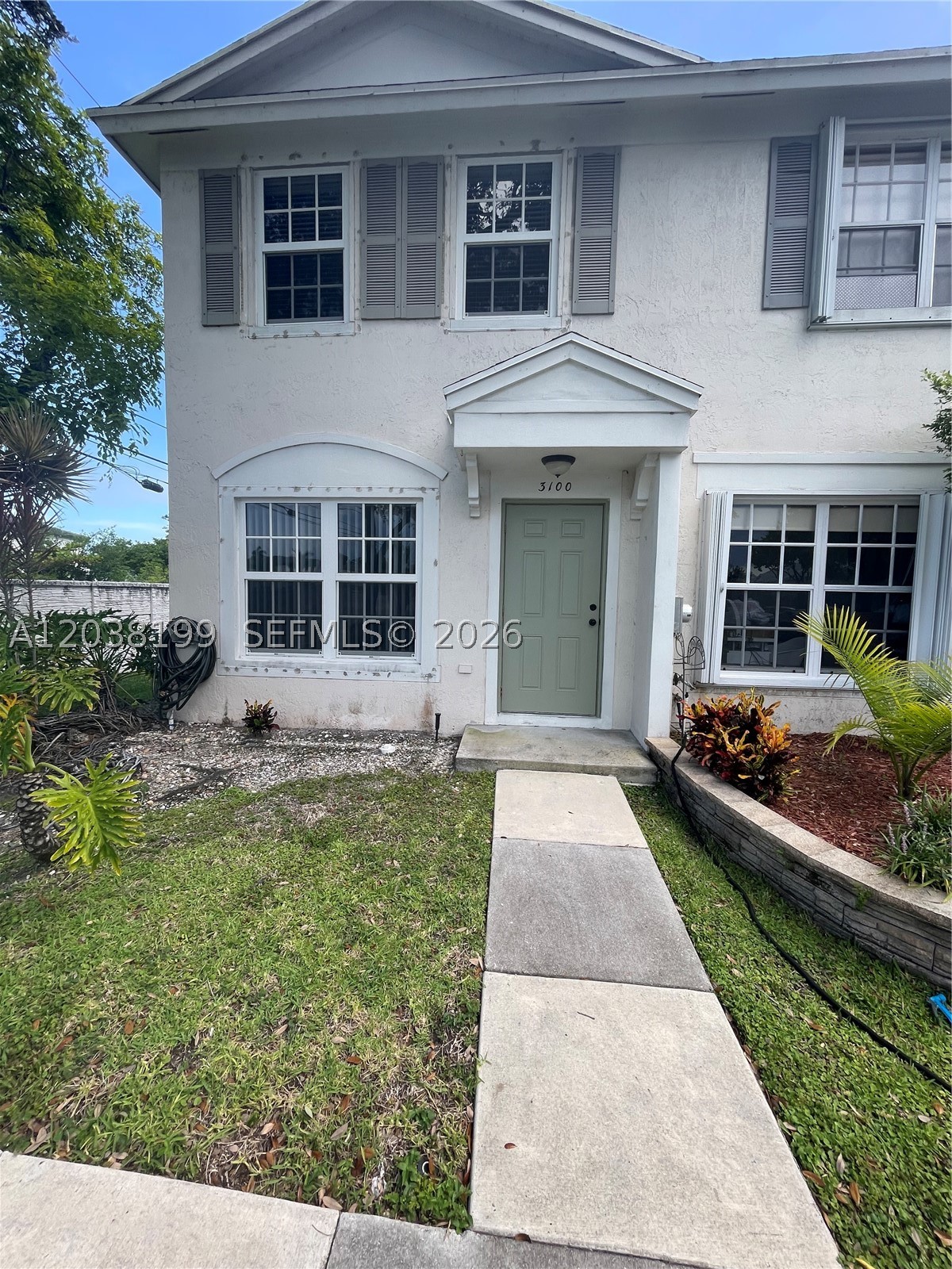 Move in ready corner unit Townhouse in the very desirable Banyan Oakridge Gated Community. Home feels larger than the actual floor plans. Step right in to your living room from your dedicated parking space, nice size dining area, White Kitchen Cabinets w/ stainless steel appliances, side by side washer & dryer, practical half bath for your  guests. 2nd floor consists of 2 bedrooms and 1 full bath with an extra large bathtub, and separate shower area. Upgraded High Impact windows throughout entire home, saves on energy, limits outside noise,  AC 2023, Water Heater 2019, Enjoy your morning coffee on your screened patio and lots of private green space in your side and back yard. Plenty of guest parking.