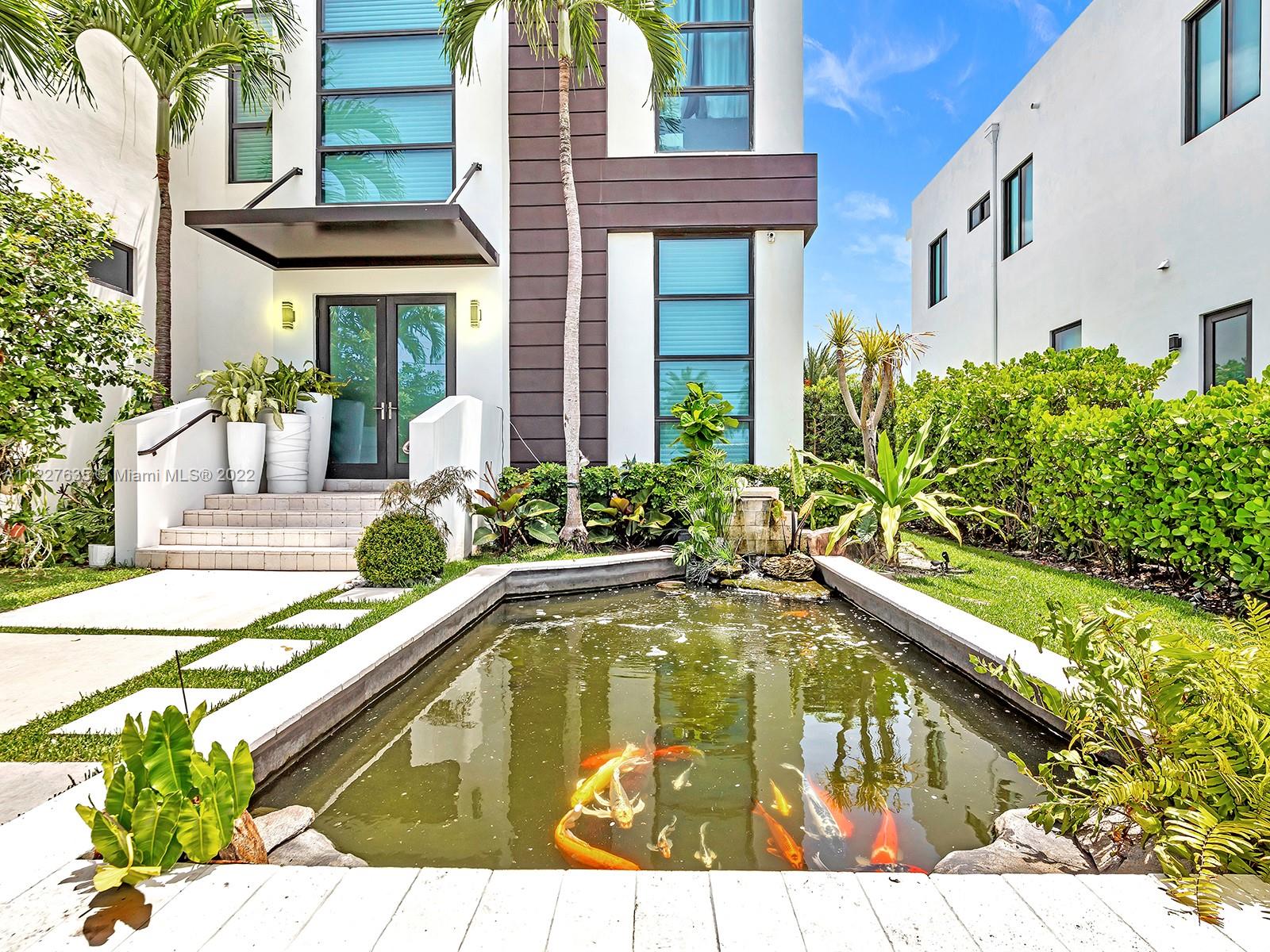 Located in exclusive and gated Sans Souci Estates known as North Miami's "hidden gem" is this modern two-story waterfront home with direct bay/ocean access.

The 4,818 SF, six bedrooms + den/in-home office, seven bath home features a spacious floor plan with soaring 10 ft+ ceilings, a grand master suite including his/hers wood and leather finished walk-in closets and a massive balcony over looking the water. Open gourmet kitchen featuring Wolf gas cooktop, Sub-zero fridge/built in wine cooler. Complemented by custom-designed closets throughout the home for ample storage, a large laundry room, 
salt water pool, jacuzzi, private dock, boat lift, fish pond, two-car garage + four-car driveway. 

Short drive to the Beaches and some of the finest shopping, dining & entertainment.