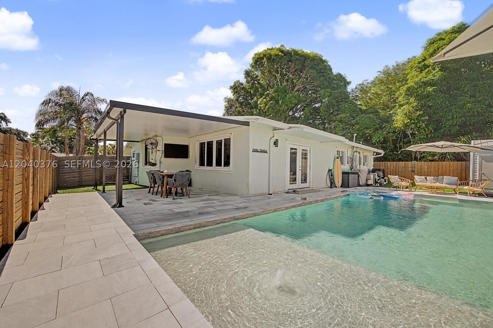 Welcome to this beautifully updated 3-bedroom, 2-bath pool home in the desirable Riverland area of Fort Lauderdale. Situated on a corner lot, this move-in-ready property offers exceptional outdoor living, modern upgrades, and an unbeatable central location, just a 10-minute drive to Downtown Fort Lauderdale, Las Olas, Fort Lauderdale Beach, shopping and dining.
Custom heated salt water pool (built 2 years ago)with low-maintenance artificial turf and new fence installed with the pool.Aluminum-covered patio, storage shed — ideal for entertaining and outdoor living,2-year A/C with 8 years left on warranty and brand-New electrical panel,New hurricane-impact frosted glass front door
Brand-new washer & dryer,240-volt EV charging station in carport.
Family-friendly neighborhood with a true sense of community and many young families. Kids are still outside playing and riding their bikes. 
*Full transparency / important disclosures
Roof is 10 years old but needs replacement; seller is offering a credit at closing toward a new roof.
Laundry drain line from the exterior needs repair; seller is offering a credit at closing toward repair of the laundry line.
Property shows normal wear and tear from a young family; a few cosmetic updates/repairs are recommended — suitable for a DIY buyer or someone comfortable with light touch-ups. 
This home combines turnkey outdoor amenities with thoughtful mechanical updates and offers flexibility for buyers to personalize interior finishes.
