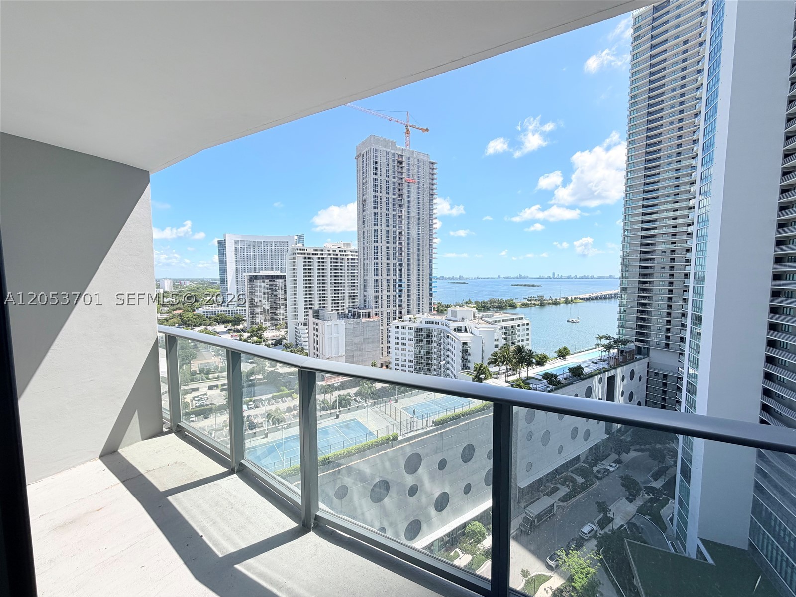 Spectacular waterfront 1BR/2BA unit with breathtaking bay views, available furnished or unfurnished. Features high-end Bosch appliances, modern kitchen with premium finishes, smart thermostats, energy-efficient features, and wood laminate flooring throughout. Enjoy world-class amenities including 2 pools, Jacuzzi, tennis and pickleball courts, gym, spa, dock, and waterfront restaurant. Prime location with easy access to major highways, just 7 minutes to Downtown Miami/Brickell, and close to Miami Beach, Design District, Midtown, and Adrienne Arsht Center.