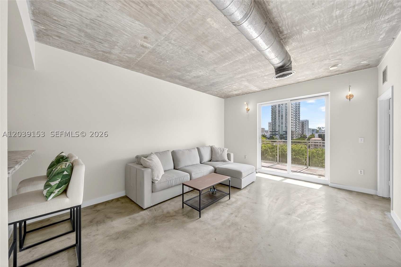 *FOR SALE* 1 Bed + Den, 1.5 bath with a large private balcony at Baylofts in Edgewater Miami!  Open-concept living, exposed ceilings, polished concrete floors, impact glass doors, and a dining area with abundant natural light. The modern kitchen is equipped with stainless steel appliances, ample cabinetry, and generous counter space. In addition to an in-unit washer & dryer! The spacious primary suite includes custom built-in wardrobes and a private bath, while the additional half bath provides added convenience for guests. Located moments from Biscayne Bay, Margaret Pace Park, Midtown Miami, the Design District, Wynwood, and Downtown Miami.