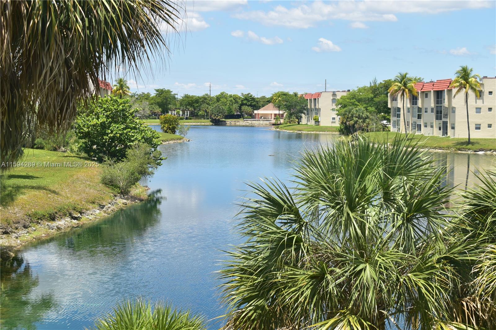 Enjoy a long lake lake view from main living area.  You'll notice that the entire condo has IMPACT GLASS windows!  NEWER A/C from 2021.  No ASSESSMENTS.  NEW ROOF 2024!  This is a condo that is easy to enjoy and whose view brings peace.  Come view this unit with nearby parking and relaxed vibe.  Sunrise Lakes Phase 1 is an active 55+ community with municipal bus service and a great location near stores, restaurants and entertainment.  It is just 30 minutes to the Atlantic Ocean driving through the city.