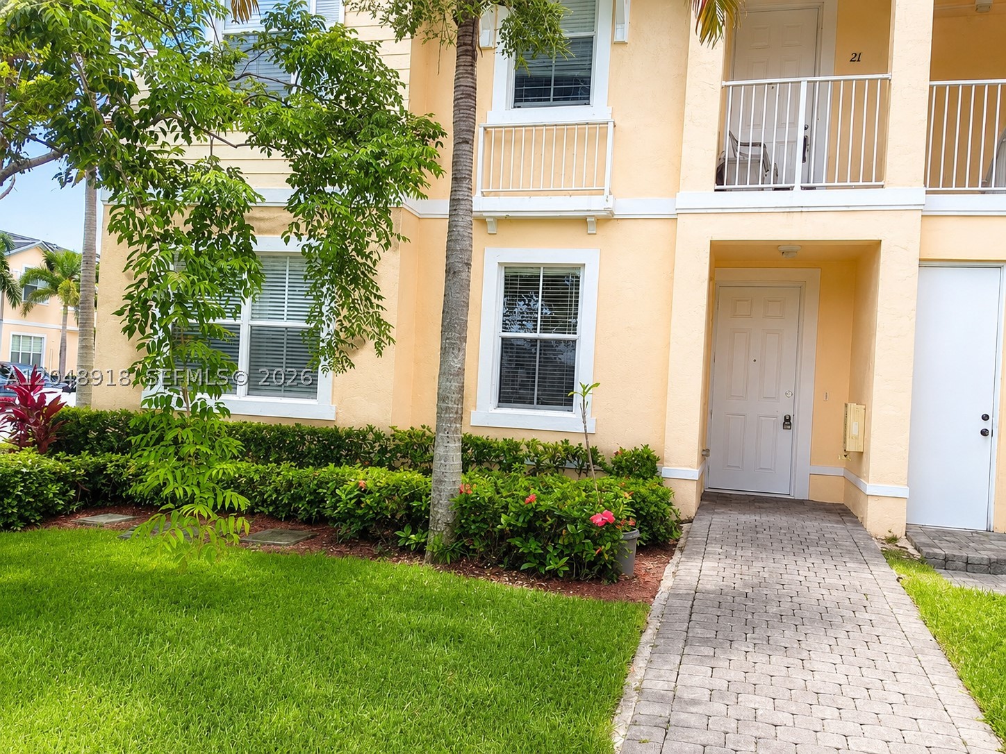 BRIGHT, MODERN & MOVE-IN READY CORNER UNIT IN FIJI! Welcome to this beautifully refreshed 3-bedroom, 2-bath, FIRST FLOOR 1-story townhome-style condo located in the gated community of FIJI Place in HOMESTEAD. This well-maintained corner residence features fresh interior paint, brand-new luxury flooring, some brand-new appliances, abundant natural light, airy vaulted ceilings, and an open-concept layout that feels spacious, modern, and inviting.    The split-bedroom floor plan offers excellent privacy and functionality, while the two-story design provides the added comfort of having no one above you. Enjoy a peaceful lake backdrop from your private balcony, perfect for morning coffee, evening relaxation, or simply taking in the serene Florida setting. just steps from the community pool AND MANY MORE AMENITIES add even more comfort.    FIJI offers a fantastic lifestyle with gated access, resort-style community amenities, and an unbeatable location close to shopping, dining, entertainment, parks, golf, medical facilities, and major roadways. Enjoy the best of SOUTH FLORIDA with easy access to Beaches, THE FLORIDA KEYS, beautiful farmlands, the everglades and all south florida has to offer. Only about minutes to the beaches and approximately 30 minutes to Miami , this home is ideal as a primary residence, seasonal retreat, or investment opportunity. Move-in ready, stylish, and perfectly located—schedule your private showing today before this beautiful Homestead area home is gone!