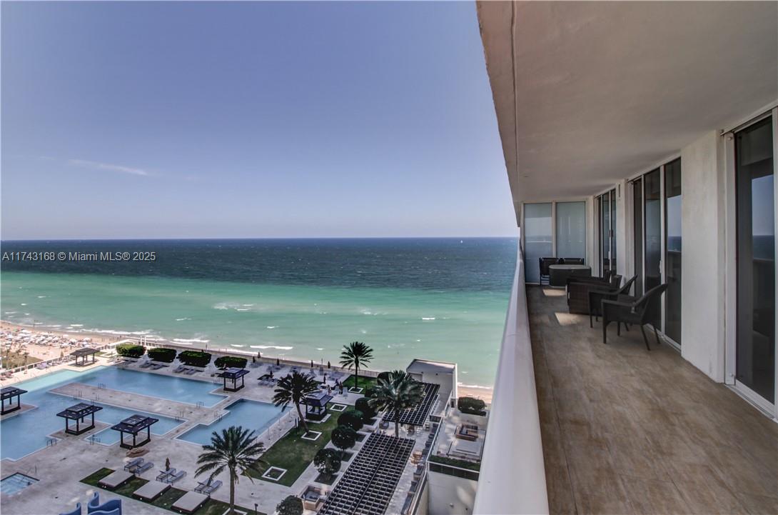 Experience luxury living in this stunning 2-bedroom, 2-bathroom unit featuring breathtaking sunrise and sunset views from the wraparound balcony, overlooking both the beach and Intracoastal. This elegantly designed residence boasts KitchenAid appliances, Euro-style cabinetry, granite countertops, and custom-finished closets. The exclusive Beach Club offers resort-style amenities, including an infinity-edge pool, full-service spa, and state-of-the-art fitness center with ocean views. Residents enjoy valet and concierge services, on-site dining, and more. Immerse yourself in the ultimate coastal lifestyle!