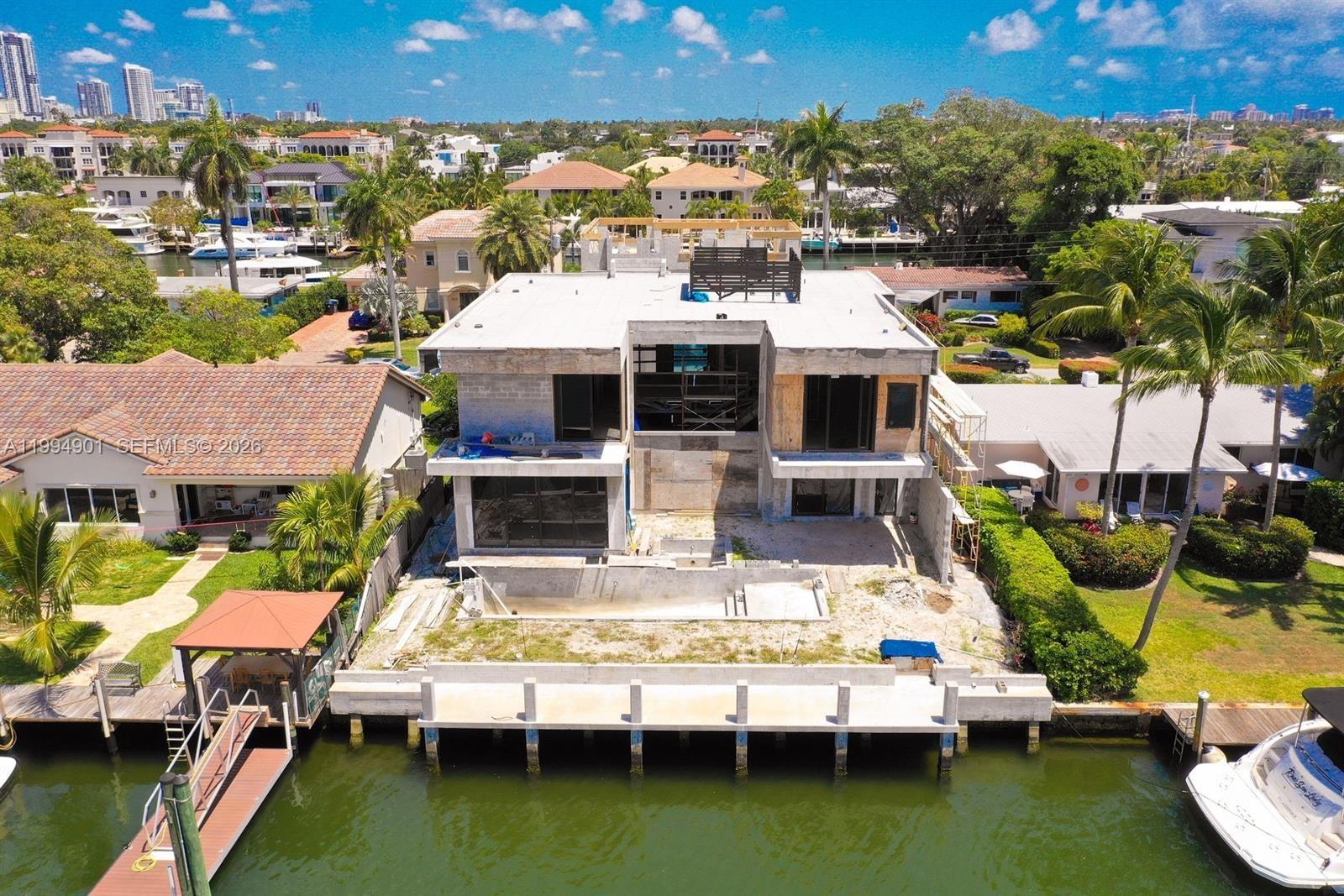 EXCELLENT INVESTMENT OPPORTUNITY! 2025 NEW CONSTRUCTION 5,891 SF 2-story residence with approved plans. $$$ BUILT IN EQUITY $$$ Open concept contemporary design in the highly desirable Rio Vista island community of Lauderdale Harbors. Situated on 70-feet of prime ocean accessible deep water with no fixed bridges, mere minutes to Port Everglades Inlet. ACT FAST. New seawall and concrete dock on a wide canal measuring over 140 ft. Plans included for Buyer to complete construction of 6 bed/7 bath with elevator, pool, spa, and lanai. Property will convey AS-IS, CASH ONLY. Closing is not subject to Seller obtaining Certificate of Occupancy. BUY NOW!