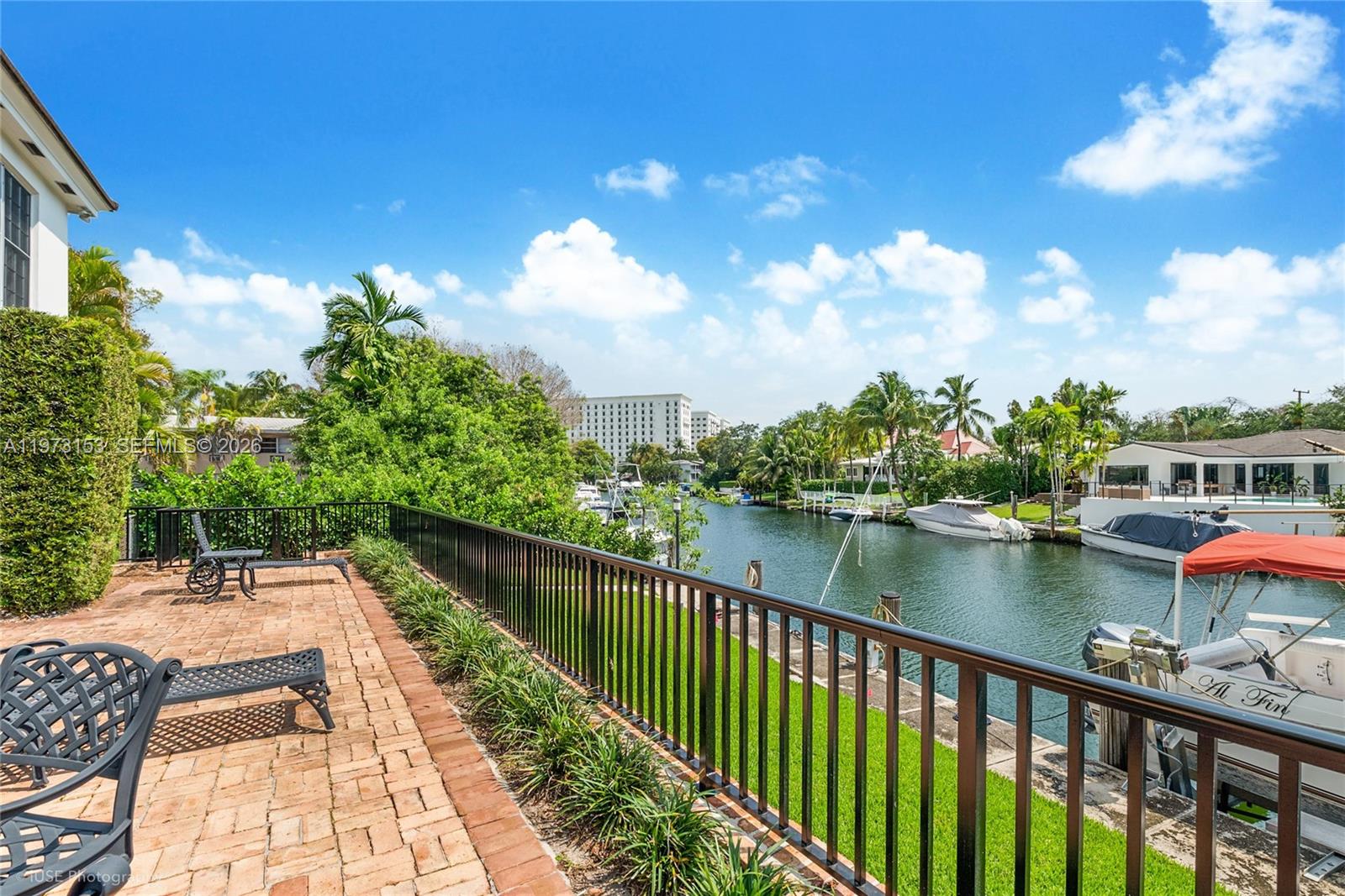 First time ever offered. A rare waterfront opportunity in Coral Gables now presented as 2 separate condominium residences. Unit A, downstairs residence, offers bright interiors & direct access to the property’s 80 FT boat dock (40 FT assigned to this unit) along a beautiful Gables waterway. Walls of windows & a sunroom frame tranquil water views while opening to a gorgeous private patio ideal for outdoor dining & entertaining. The well-designed floor plan includes an ample living room, separate dining room, & large eat-in kitchen w/granite counters, stainless appliances & counter seating that opens to the family room. This substantially updated residence features 2 large bedroom suites w/2 private baths plus a powder room, porcelain tile floors throughout, plantation shutters & abundant closet space. Additional features: an indoor laundry room w/full-size washer & dryer & space for an additional refrigerator/freezer, an exterior walk-in storage closet, & three exterior parking spaces. A charming walled courtyard entry welcomes you to this impeccably maintained property owned by only one family. New roof March 2025. Unit A is offered at $3.2M & includes 40 FT of dockage. Unit B (MLS #A11973154) is also available for $3M. Both units may be purchased together creating a rare waterfront compound w/ 80 FT of total dockage.