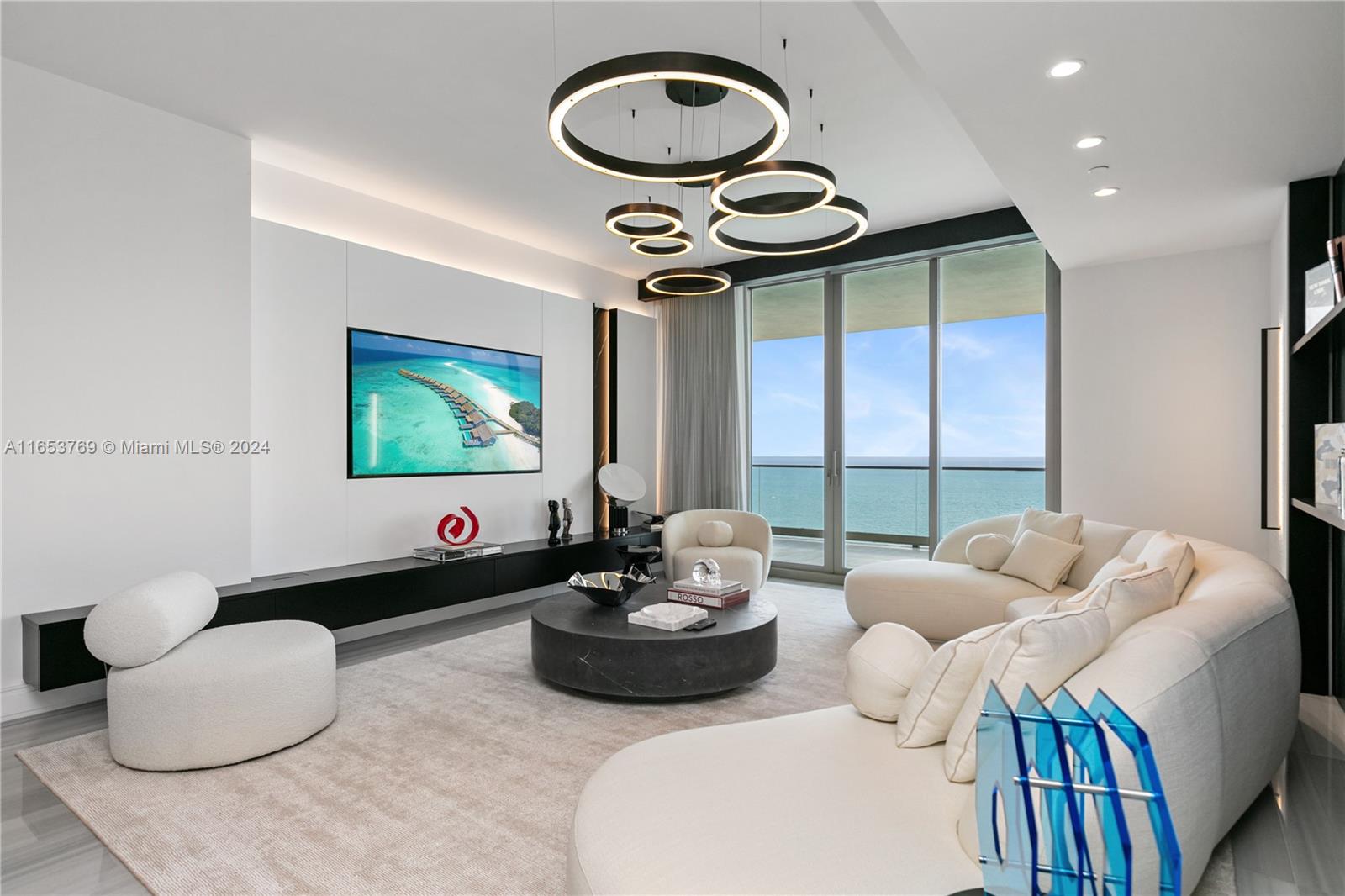 Chic and monochromatic stunner with all the right splashes of color backset by the turquoise sea, this spacious flow-thru residence boasts 4 beds plus a family room. Luxurious finishes feature genuine marble floors, custom millwork and built-ins, onyx primary bathroom w/ steam shower, Molteni closets in all rooms, chef’s kitchen with La Cornue gas range, 2 expansive terraces with summer kitchen, and smart home automation. The Estates at Acqualina is bar-none, Miami's premier luxury lifestyle property. Services and amenities feature Rolls Royce House Cars, 5 world-class restaurants including Avra, Il Mulino, Keuh, Costa Grill and Toscana, 3 pools with SurfRider/slide, daily breakfast, cinema, skating rink, bowling, F1, golf simulator and basketball court!