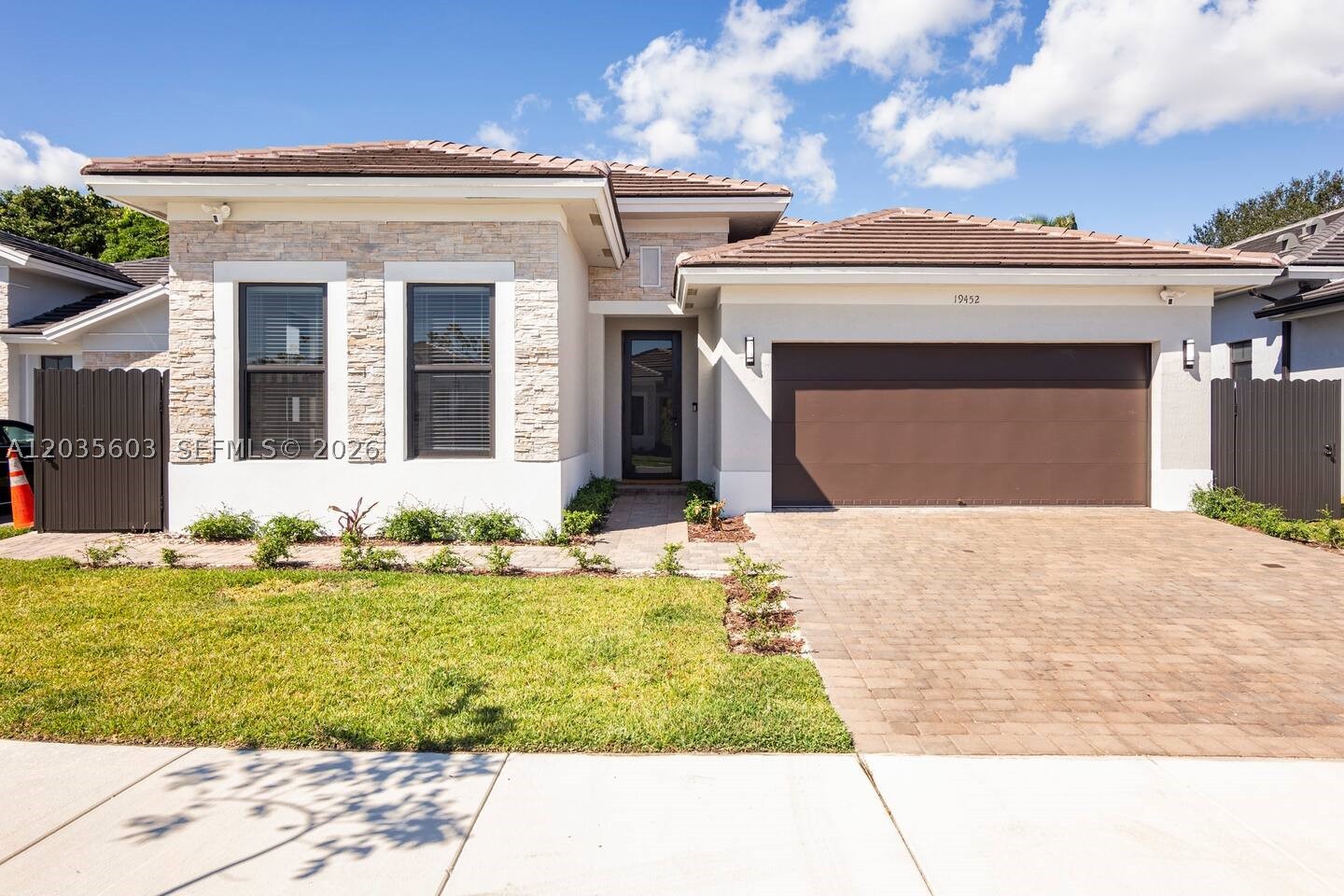Tenant occupied, 48 hour notice required. Stunning 2023-built home featuring 4 bedrooms, 3.5 bathrooms, and a 2-car garage on a fully fenced lot. This modern residence offers impact windows and doors, oversized light grey ceramic tile flooring, volume ceilings, and a bright open-concept layout. A private 1-bedroom, 1-bath in-law suite with its own entrance and kitchen provides added flexibility for extended family or guests. Conveniently located near Zoo Miami, Tropical Park, Southland Mall, shopping, dining, and major highways