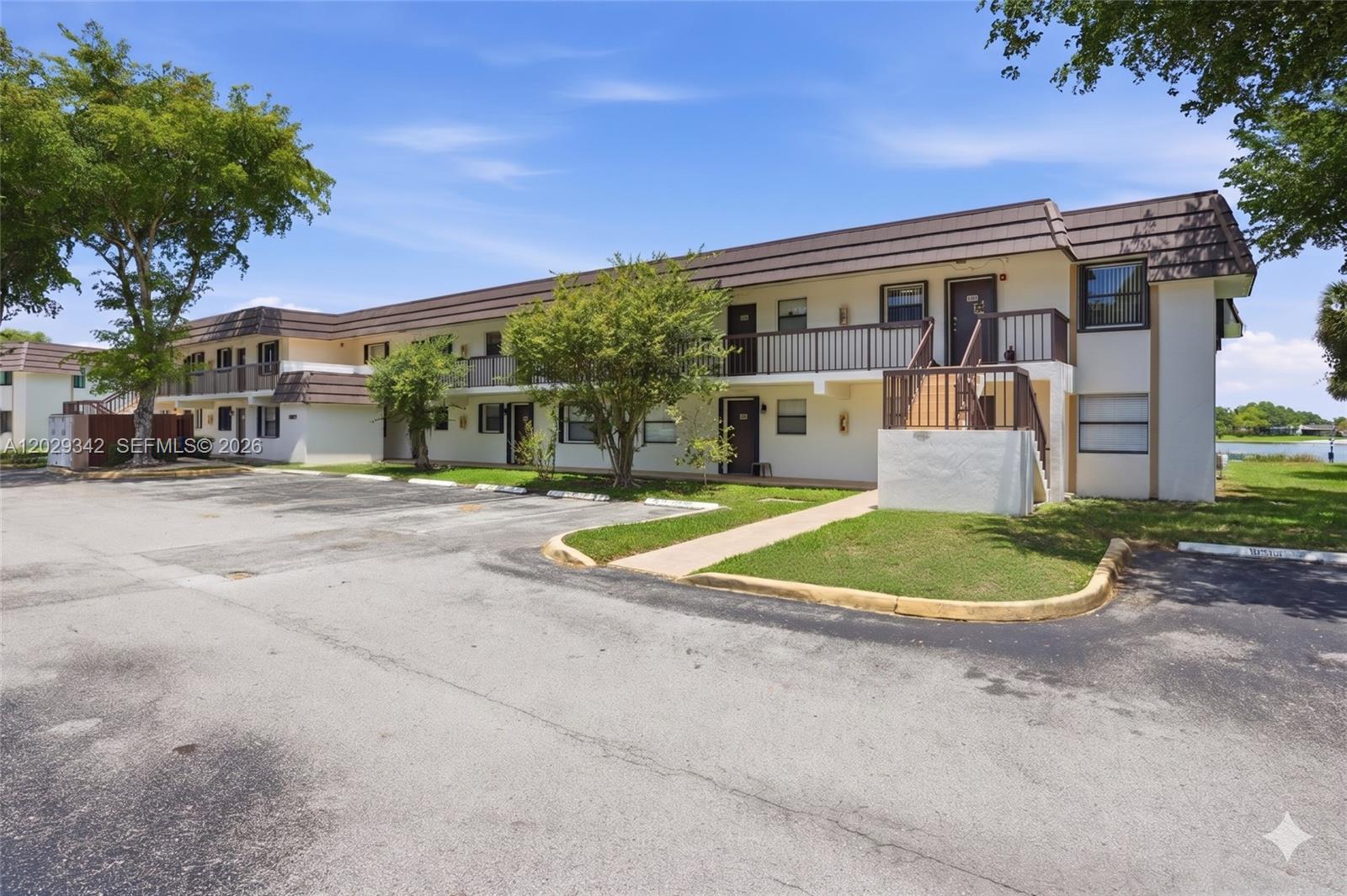 Welcome to your own slice of tranquility in the heart of Kendall. Located within a charming, well-maintained community, this 2-bedroom, 2-bathroom condo at 14873 SW 104th St, Unit 6-203, offers the perfect blend of comfort, convenience, and lifestyle. Enjoy peaceful lake views from your private balcony, creating the ideal setting for morning coffee or relaxing sunset evenings. Inside, the desirable split-bedroom floor plan provides privacy and flexibility for guests, a home office, or roommates. The assigned parking space is conveniently located directly in front of the unit, with ample guest parking available throughout the community. Residents enjoy a true resort-style lifestyle with access to three Hammocks clubhouses featuring pools, a children's pool, fitness center, basketball, tennis and racquetball courts, volleyball, and more. Outdoor enthusiasts will appreciate approximately 12 miles of scenic trails surrounding the lake. Ideally located within an A-rated school district and just minutes from Miami Dade College Kendall Campus, shopping centers, dining, and major expressways, this home offers exceptional convenience. With a very low condo fee and a floor plan that makes renting easy, this property is an excellent choice for homeowners and investors alike. Experience comfortable lakeside living in one of Kendall's most desirable locations.