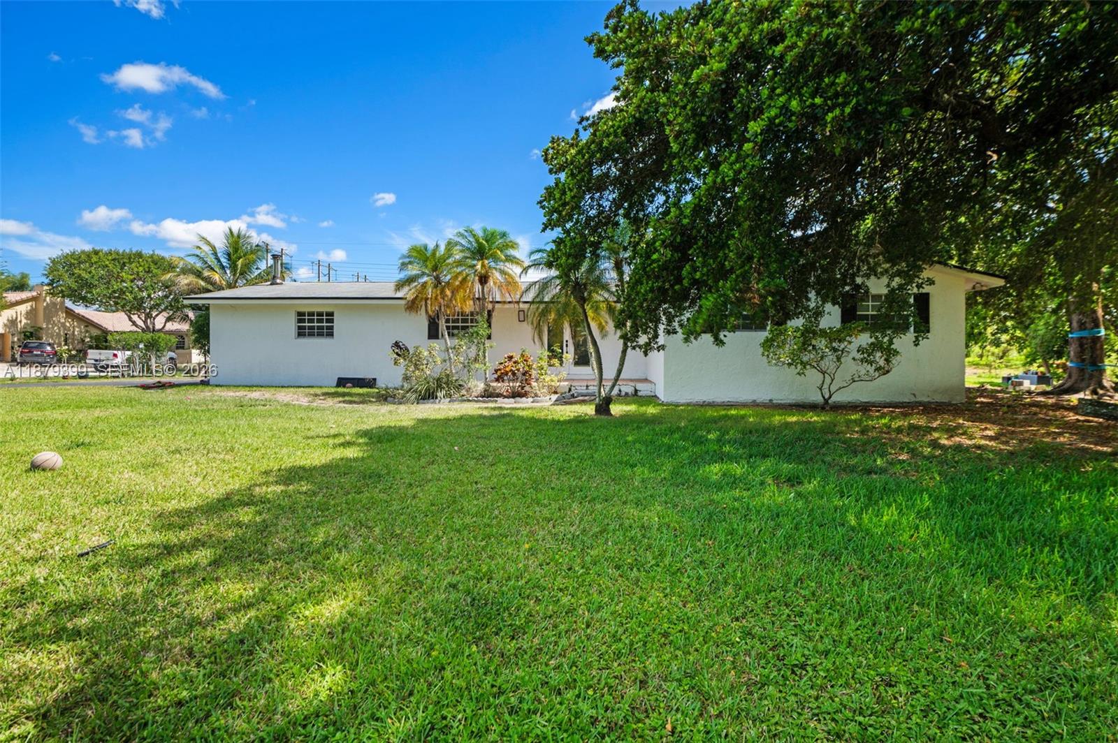 Fall in love with this beautifully renovated modern farmhouse on 2.5 acres in peaceful Southwest Ranches. Featuring a quartz waterfall kitchen, new appliances, impact windows and doors, private mother-in-law suite, barn, workshop, pool, and tranquil outdoor living. Most renovations completed! New roof 2021, HVAC 2024, beautifully updated with new wood look vinyl plank flooring. Work shop already has a car lift Close to I-75, 595 and Sawgrass exp. A must see!