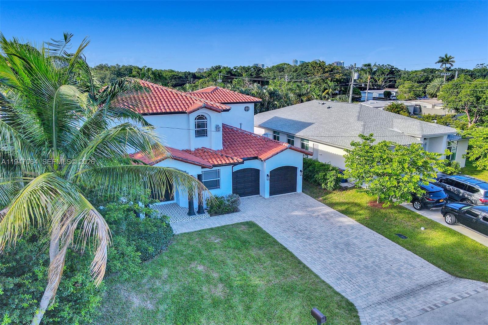 Welcome to your private tropical retreat in the heart of Fort Lauderdale, where space, location, and lifestyle come together seamlessly. Situated near Fort Lauderdale’s most vibrant areas, this exceptionally spacious 6-bedroom, 4-bath home offers over 3,600 sq ft under air, a rare find so close to downtown, Las Olas Boulevard, and the beaches.
From the moment you enter, the home impresses with soaring ceilings, open living areas, and abundant natural light, creating a bright and inviting atmosphere. The layout is designed for both comfort and entertaining, with expansive gathering spaces and a seamless flow throughout. A 2-car garage and ample interior space add to the home’s functionality and convenience.
Step outside and the property transforms into a fully private tropical oasis. The fenced backyard features a sparkling pool, lush landscaping, and multiple lounge areas—perfect for relaxing, entertaining, or enjoying South Florida’s year-round sunshine. The setting feels secluded and peaceful while still being in the center of everything.
Location is a major highlight. You’re just minutes from downtown Fort Lauderdale, the energy of Las Olas Boulevard, top dining, shopping, and the beach, along with easy access to major highways and the airport. It’s the ideal balance of privacy and accessibility.
Move-in ready with washer and dryer included and pet-friendly, this home offers a lifestyle where space, comfort, and prime location all align.