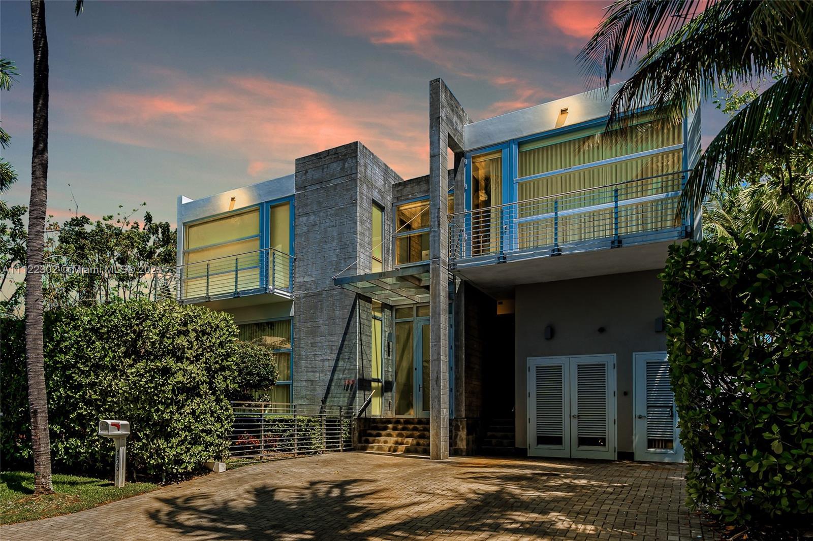 Striking contemporary design and solidly built concrete construction from top to bottom, unlike any other property. This magnificent fortress features floor-to-ceiling high impact windows that illuminate this home with natural light throughout. This almost 4,000 sf, 2-story suits anyone's needs complete with 5Bd/4.5Bth +maid's quarters. Marble and wood flooring in all areas, a chef's Mia Cuccina kitchen, German bathroom fixtures and accessories, interior/exterior garden patio + balconies w/all bedrooms highlight this extraordinary residence. The covered terrace/barbecue area overlooks the inviting pool and waterfall/hot tub. An exquisite home in the tropical island paradise, Key Biscayne!