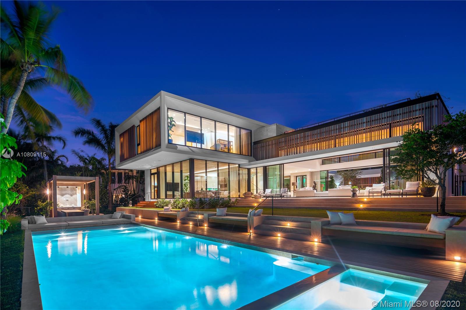 Contemporary waterfront home on gated Sunset Island 4 is the epitome of luxury living in Miami Beach. Marked with striking, yet functional ultra-modern design, this architectural masterpiece is offering grand living room with soaring 14-ft ceilings as the centerpiece of the home, chef’s kitchen adjacent to a large family room, formal dining situated by an interior courtyard, 4 beds in main house, 2 guest suites, & a staff room. Finishes include wood-detailed ceilings, Crestron system, LED lighting, wall-to-wall sliding doors, marble baths. Luxury amenities, elevator, resort-style pool deck with a summer kitchen, roof top deck, new seawall, & a large dock. Next to Sunset Harbour & the best of Miami Beach’s local lifestyle. Domo Design, Todd M. Glaser built. Staged by Artefacto.