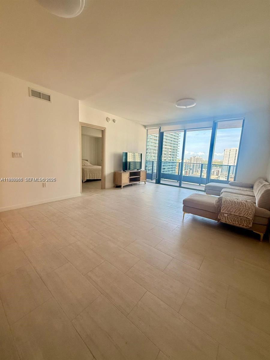 .ndulge in elevated urban living at the iconic Flatiron Brickell, where contemporary design meets unmatched sophistication in the heart of Miami.



This exceptional 1-bedroom, 1.5-bath residence showcases breathtaking skyline views through dramatic floor-to-ceiling impact glass, filling the home with natural light and an undeniable sense of scale. The open-concept layout is perfectly designed for both entertaining and refined everyday living.



The chef-inspired kitchen is outfitted with top-of-the-line Miele appliances, seamlessly blending elegance and performance. The primary suite is a private sanctuary featuring a spa-quality bathroom with dual rain shower and a deep soaking tub enclosed in sleek glass finishes, delivering a true five-star experience at home.



Residents enjoy world-class amenities, including a stunning rooftop pool with panoramic city and bay views, full-service spa, and state-of-the-art fitness center — all curated to match a luxury lifestyle.