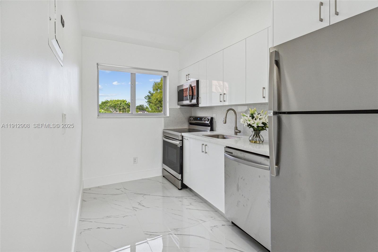 Discover this beautifully renovated 3-bedroom, 1-bathroom apartment, perfectly situated on the heart of North Beach. The unit features new floors throughout, stainless steel appliances, and granite countertops. Enjoy modern comforts like a central AC system, an in-unit washer and dryer, and built-in closets. With fresh paint and impact windows, the apartment is filled with an abundance of natural light. Plenty of street parking is available. The location is ideal for an active lifestyle, just a short walk from the beach, local restaurants, and Bal Harbour. QUALIFIED TENANTS CAN MOVE IN WITH JUST THE FIRST MONTHS RENT AND SECURITY DEPOSIT. This unit will be available starting January 1st, 2026.