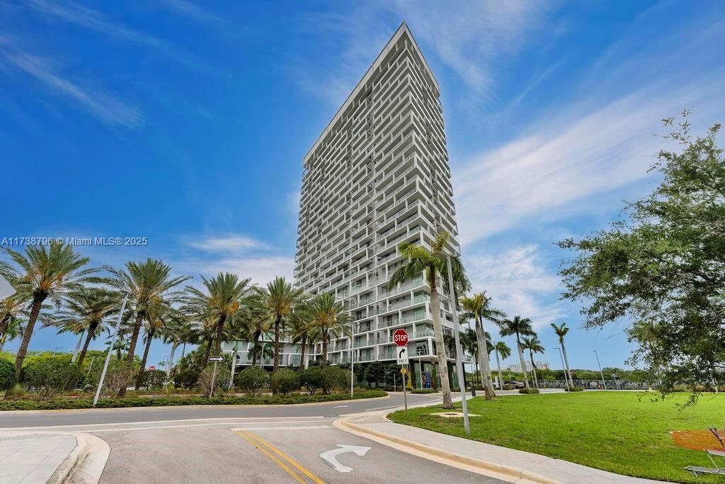 This stunning luxury 2-bedroom, 2-bathroom unit in Metropica, is situated on a high floor and boasts top-of-the-line stainless steel appliances, elegant Italian cabinetry, and pristine white waterfall quartz countertops. Floor-to-ceiling impact windows offer panoramic views, flooding the space with natural light, while porcelain floors run throughout. The building offers a full range of resort-style amenities, including a state-of-the-art fitness center with Technogym equipment, a spa, sauna, and steam room. Additional features include a business center, kids' playroom, theater, party room, and an indoor club room with a bar, lounge, and kitchen. Outside, enjoy an infinity-edge pool, jacuzzi, BBQ area, full-size tennis courts, and a pet spa. With 24-hour security and valet service included