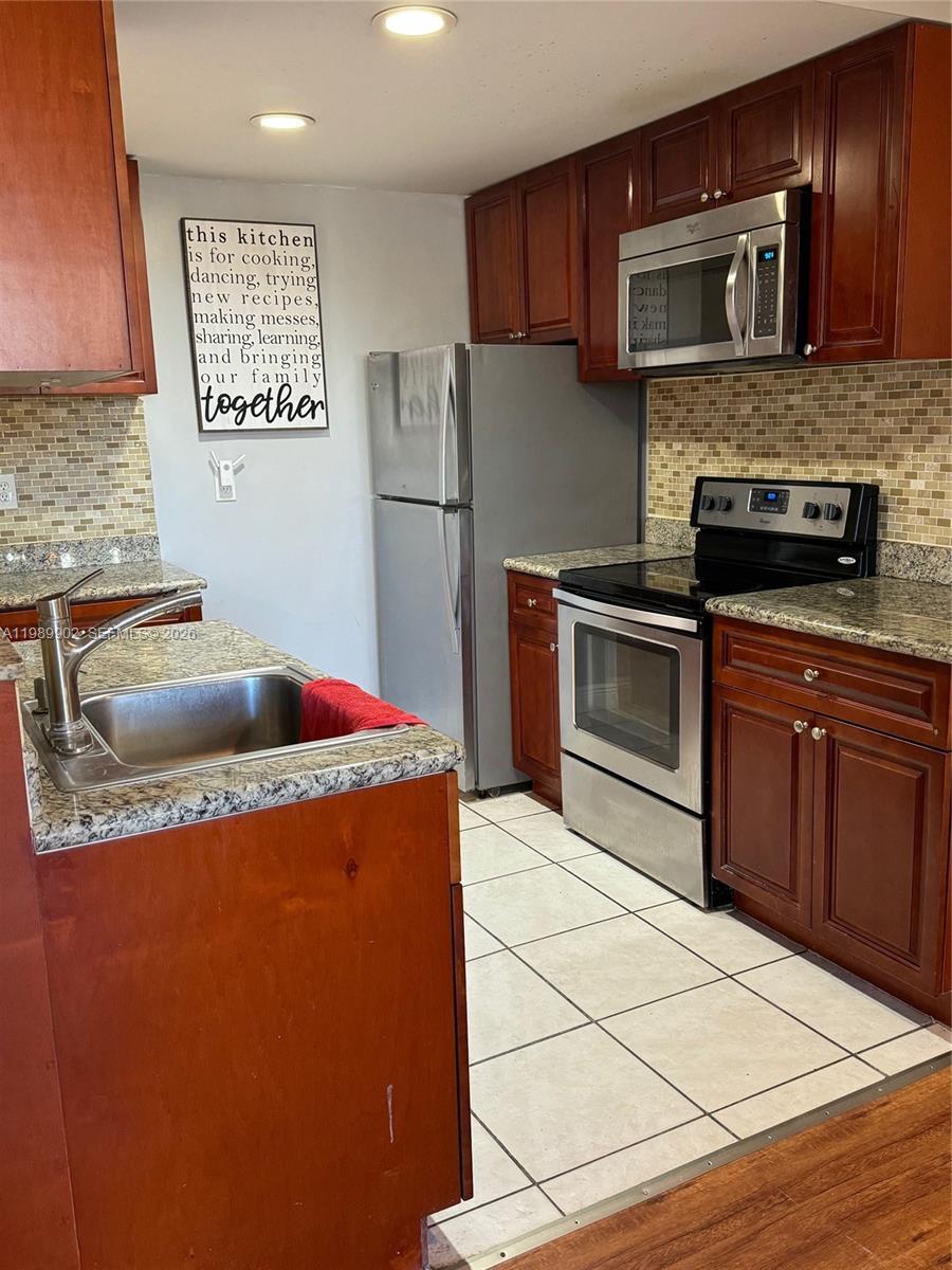 Beautifully renovated 2 bedrooms 1 and a half baths condo for sale.   This home has a new open kitchen with solid wood cabinets in cherry color, granite countertops in the kitchen and bathrooms,  S.S. appliances, newer bathe rooms, newer toilet, private balcony, new floor in living room... The unit is a few steps to the elevator. The building is conveniently located across the street from Miamidade college main campus, a few blocks from the hwy 874 and Turnpike, close to 2 Publix and many other shops and restaurants.  The community has 2 tennis courts, pools, clubhouse and children playground.  Come see it!  This beautiful and comfortable home could be yours soon!