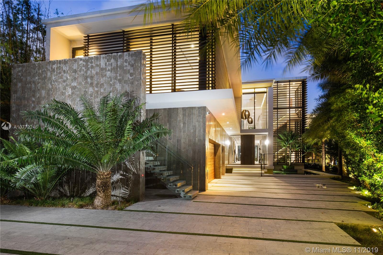 Contemporary home on gated Palm Island , wide breathtaking bay views. Step inside to immediate water views, select finishes, custom furniture & design accents throughout. Artistic wine cellar, dedicated theater, fully automated smart home. Custom Italian kitchen with concealing sliding glass.  Grand master suite offering amazing views, dual closets & dual showers. Office with private entrance. Open floor plan, floor to ceiling rear sliding glass doors,  Panoramic, 110ft  waterfront w large dock, infinity-edge pool & spa.  Aquablue Design  detail, & quality finishes. Architectural concepts by Borges & Associates.