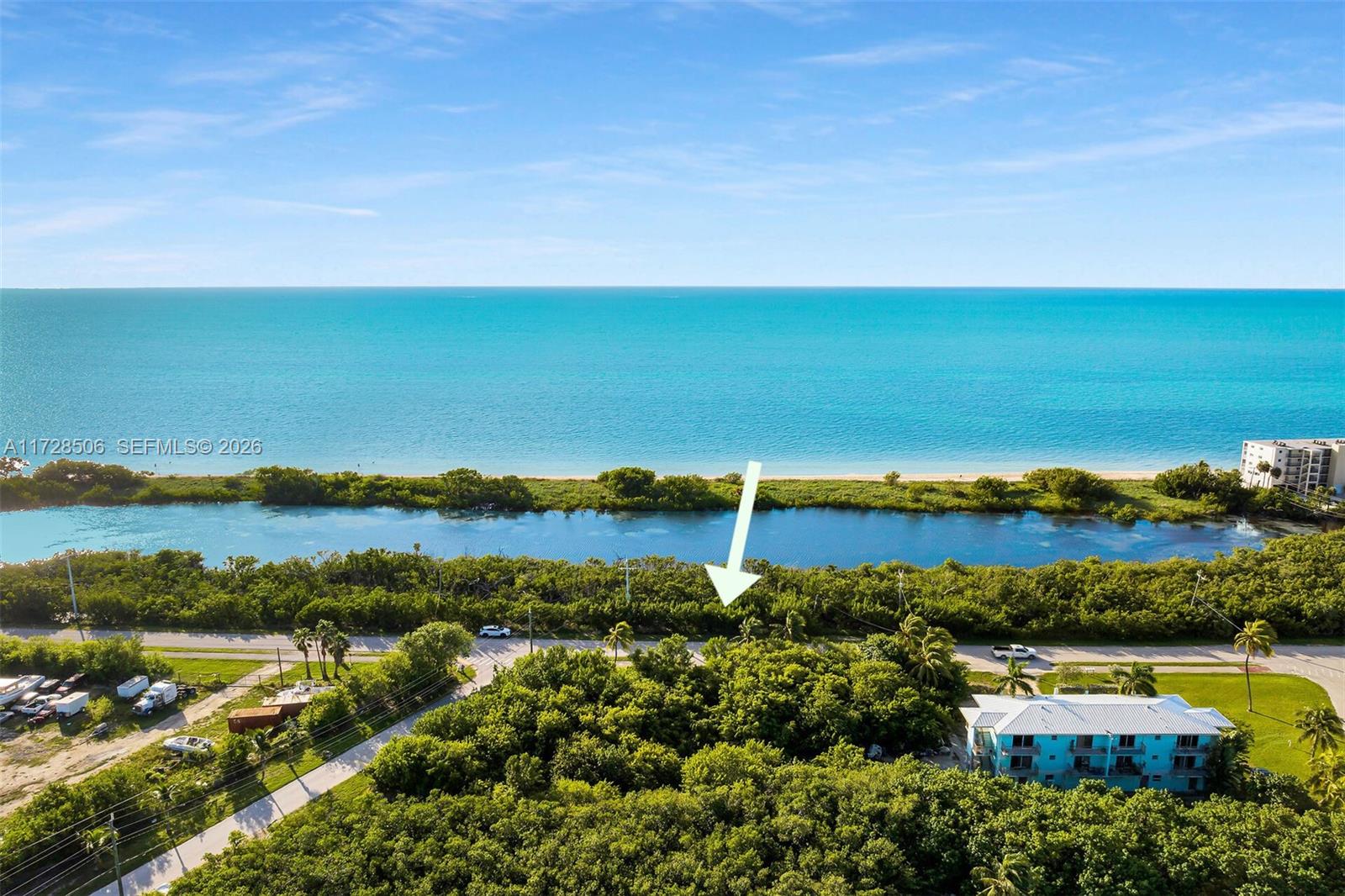 Rare opportunity to own an oversized half-acre (21,808 SF) dry lot in the highly desirable Coco Plum neighborhood of Marathon. Ideally located directly across from Coco Plum Beach, this oversized parcel offers beautiful ocean views and endless possibilities in one of the Florida Keys’ most sought-after locations. Enjoy easy access to the beach, boating, fishing, dining, and all that Marathon has to offer. Large lots in this location are becoming increasingly difficult to find. Whether you’re looking to secure a future investment or explore development opportunities, this property offers a unique chance to own a prime piece of the Florida Keys lifestyle. Wake up to breathtaking views, salty breezes, and quiet serenity. Don’t miss this rare chance to build steps from the beach with panoramic water views. Buyer to verify all building and development requirements with the City of Marathon.