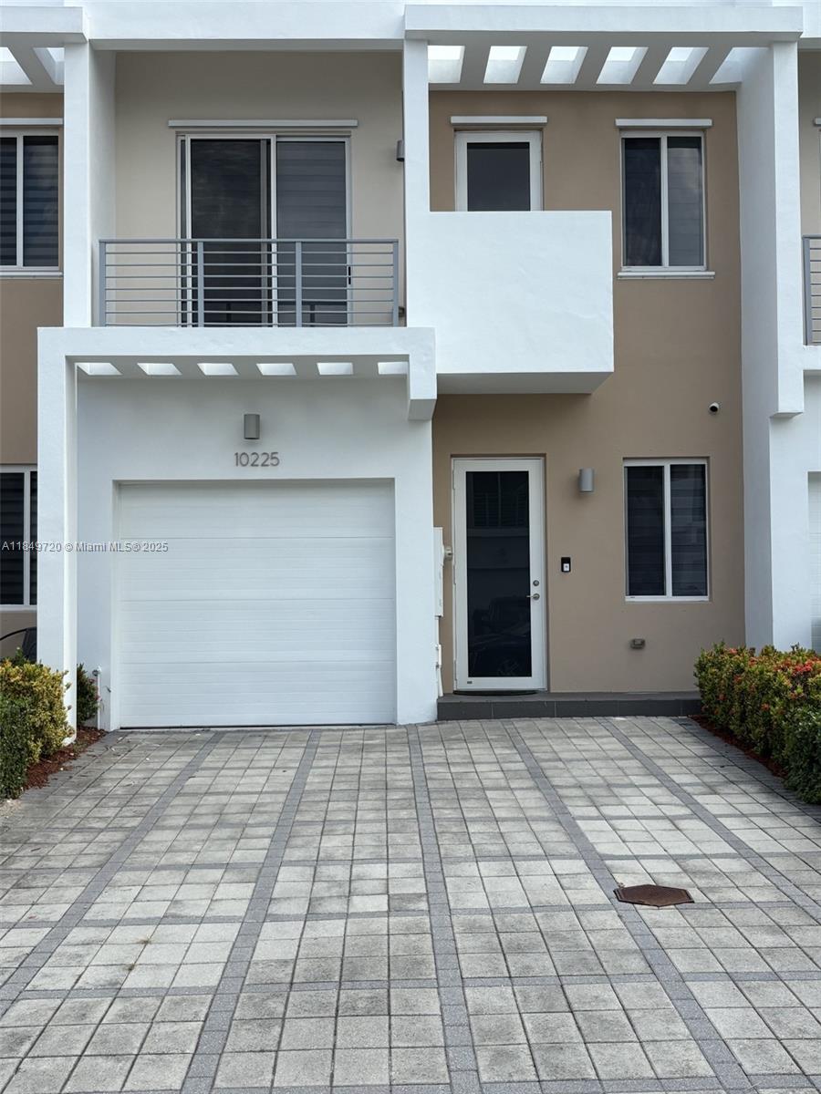 Experience the perfect blend of style and comfort in this modern townhouse and make it your new home, in Neovita at Doral.  This 4 bedrooms and 3 full bath, with 1 convenient bedroom with a 1 full bathroom on the first floor.  Kitchen Island with quartz countertops, and stainless steel appliances. 1 car garage, 2 cars driveway, and guest parking available. high impact windows, tile and laminated good quality wood floors . Nice patio with no neighbors on the back. Close to shopping malls, and Top-rated schools.  Easy access to major highways such as Turnpike and 836. Gated Community with a modern clubhouse, swimming pool, multipurpose room, Gym, and playground.
