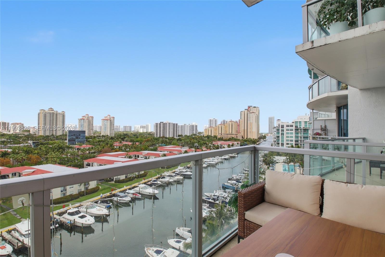 Rare opportunity to own a true loft-style residence in the heart of Aventura with soaring 11’ ceilings and dramatic floor-to-ceiling impact windows showcasing beautiful flow-through water and city views.
This 3-bedroom, 2-bath home offers 1,362 SF of interior space, complemented by two private terraces, exposed concrete ceilings, and a sleek combination of porcelain tile and laminate flooring, creating a modern, elevated living experience.
The building features a full range of amenities including a heated saltwater pool, jacuzzi, fitness center, sauna, steam room, tennis and basketball courts, business center, resident lounge, valet, 24-hour security, and private marina.
Pet-friendly community with cable and high-speed internet included in maintenance.
Ideally located in one of Aventura’s most convenient pockets — walk to Publix, restaurants, and Aventura Mall, and just a short drive to the beach. An A+ rated school is located directly on the same street, adding exceptional value for end users.

A new luxury padel and spa club is set to open next to the building, further enhancing the lifestyle and long-term appeal of this location.