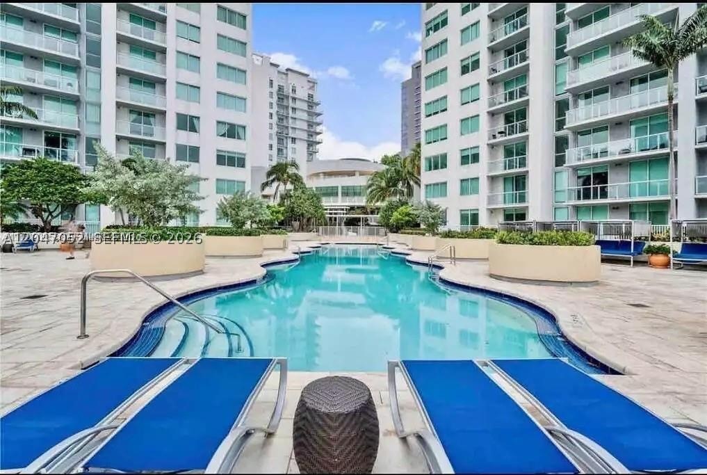 Beautiful 2BR / 2Bath in the full-service Vizcayne Condominium in Downtown Miami. Enjoy gorgeous west-facing sunset views from this split floor plan that also works well for roommates. Recently freshly painted, mahogany wood floors throughout and marble tiled bathrooms. Primary Suite has spacious marble tiled bath w/ double sinks & separate soaking tub + stand-up shower. Kitchen features black granite counters & breakfast bar with stainless steel appliances. Washer/dryer in unit.  Additional storage closet by kitchen great for luggage or kitchen pantry. Parking and WIFI  is included. Exceptional amenities include full spa (sauna & steam) with new COLD PLUNGE, fitness center, gym, pool w/ pool service, running track, residents lounge, business center and more. Across from Bayside Marketplace & near the best restaurants, museum & sports. Live a true downtown lifestyle!