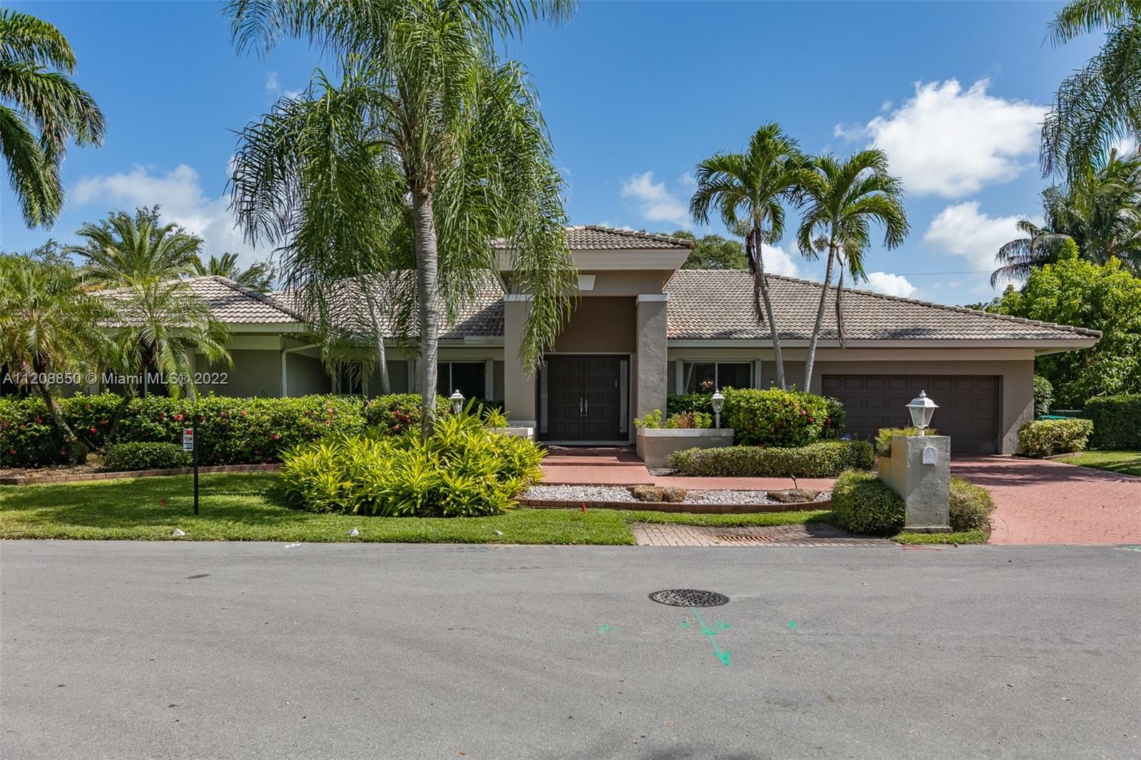Welcome home to this stunning four-bedroom, three-bath open floor plan home designed for entertaining in the private, gated community of Old Cutler Palms in Palmetto Bay. Grand foyer entry with great natural light, volume ceilings, tile floors, and recessed lighting. Spacious eat-in kitchen with island and stainless steel appliances. Primary suite with double walk-in closets and big bath w/ garden tub and shower. The exterior has a covered terrace that overlooks a spacious screened pool which is an ideal space to entertain friends and family. Close to Deering Estate, parks & top-rated schools. A must-see to appreciate.