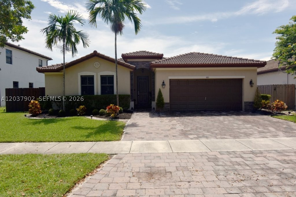 Absolute Gem! Step inside this beautiful home designed to look like a model home. Sellers have paid attention to details in creating this home. The 4-bedroom & 3 full baths provide enough space for everyone's comfort. A great feature is an in-law quarters that comes equipped like a mini apartment with its own kitchenette, living room, bedroom & patio door exit to the backyard, which is enclosed with privacy fencing. Additional features include a dining room that can also serve as an office space as the kitchen offers a bar area for eating. Entertain or just relax in the living room or family room spaces. Drive up to the home & gaze at the well landscaped yard with its great curb appeal & pull into the 2 car garage. Furnishings are negotiable, to include a home theatre system.