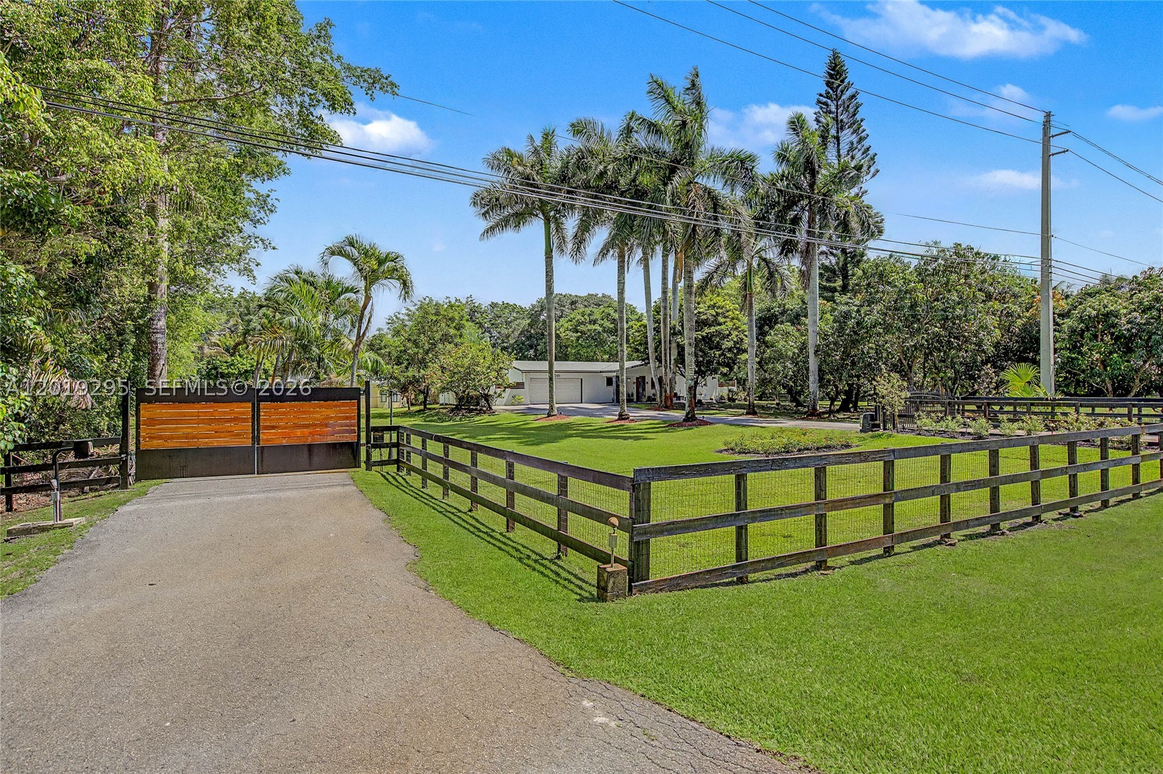 A rare Davie estate offering privacy, acreage, and a unique story in the heart of horse country. Set on approx. 1.6 acres behind two electric gates, this gated compound features an updated 3BD/2BA main residence, a detached 1BD/1BA guest house with its own kitchen, and a separate studio structure that is home to Cutting Cane Recording Studios, an approx. 1,380 SF creative space with a remarkable music legacy. The property also features a pool, mango and avocado trees, and an existing horse barn offering a strong foundation for equestrian use. With multiple structures and expansive outdoor areas, the property offers incredible flexibility for horses, guests, work, wellness, creativity, or a private retreat. Located with convenient access to highly regarded schools, parks, major highways, and Davie’s equestrian trails.