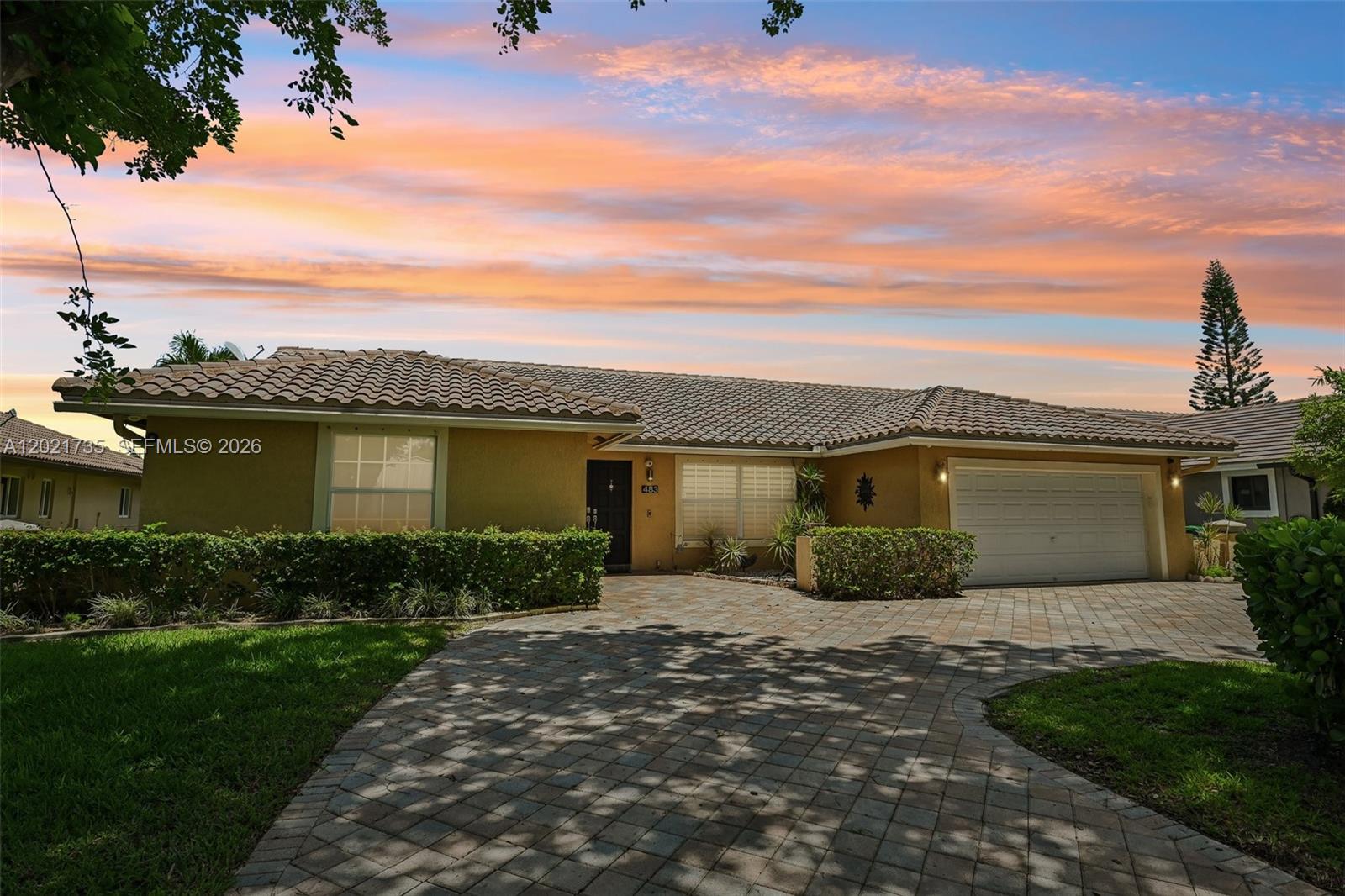 Searching for a 4-bed single family home in Coral Springs with a water view, pool, and updated interior? Welcome to 483 NW 107th Ave in the desirable Cypress Glen subdivision, where comfort, outdoor living, and functional design come together on a spacious 9,000 sf lot. This well-maintained single family home offers 4 bedrooms, 2 full bathrooms, 1 half bath, and 2,166 living sf with no HOA. Built in 1983, the property features impact windows, a circular paver driveway, and a bright dining area enhanced by a skylight that fills the space with natural light. There is a clean and timeless feel throughout the home. Outdoor living is a standout feature with a saltwater pool overlooking tranquil water views, a built-in barbecue area ideal for entertaining, and mature fruit trees creating a private South Florida backyard retreat. The spacious layout offers flexibility for families, guests, or work-from-home needs while maintaining comfortable indoor and outdoor flow. Conveniently located near shopping, dining, parks, and major Coral Springs roadways, this home combines location, lifestyle, and functionality.