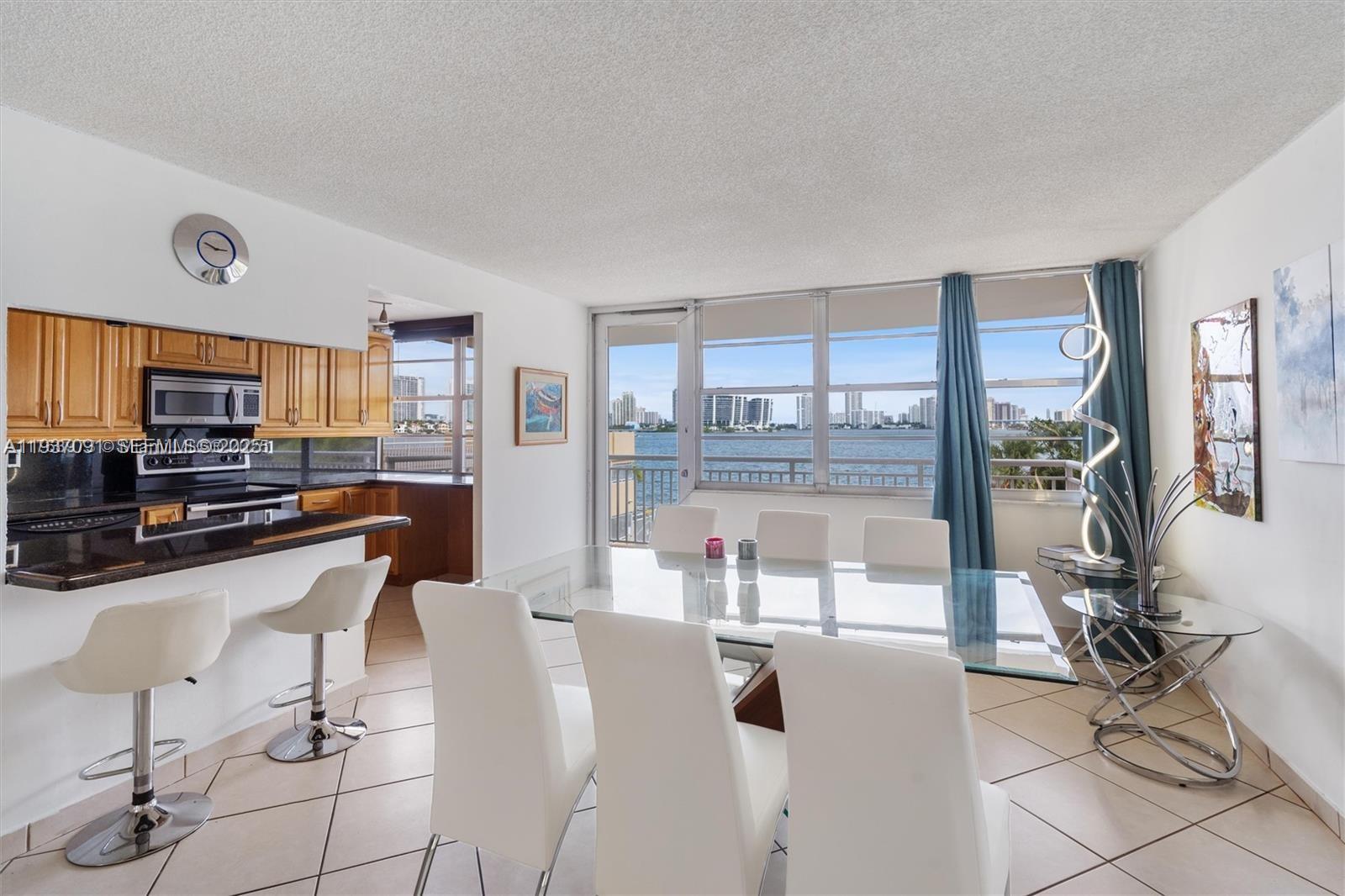 In the heart of Sunny Isles Beach! This 2-bedroom, 2-bathroom condo features an open floor plan, balcony, and breathtaking views of the Intracoastal, ocean, and Sunny Isles skyline. Water view from every room.  HOA fees include gated parking, a heated pool, gym, cable, and internet. Walking distance to the beach, shops, restaurants, parks, playgrounds, and an "A" rated K-8 school. Conveniently located near Aventura Mall, Bal Harbour Mall, and Gulfstream Park. 40/50-year certification complete. No rentals allowed during the first two years of ownership.  This building is known for a low HOA fees and good management office. Price to sell!! The best place to live is here!!! Do not miss your chance!!!