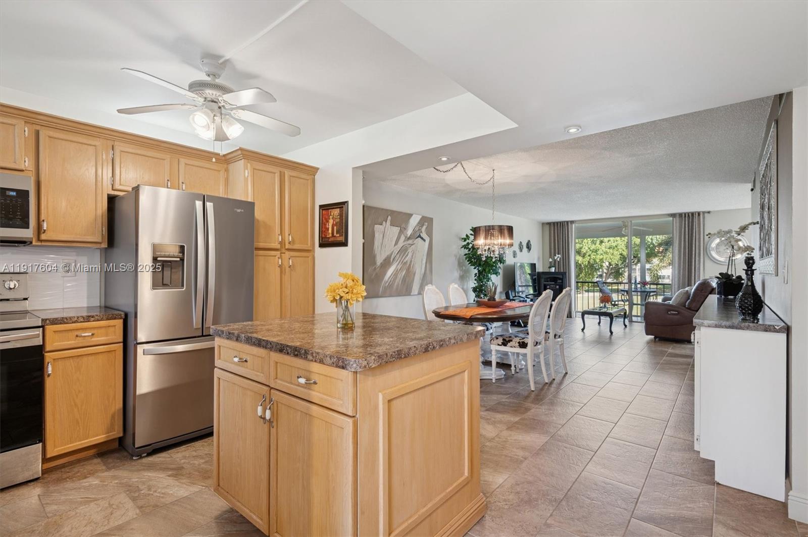 Paradise for Golfer's 
Beautiful corner unit with stunning view of the lake, fountain and the 18th hole of the par 3 course Located in a gated secure  55 +community with 1 PGA and 1 executive course , REC LEASE PAID  FREE GOLF( except car fee ) Bright 1170 sqft condo with hurricane windows in both  bedrooms , sold fully furnished and features are in unit washer and dryer . 
Steps away  from the  heated pool (7)  the restaurant and  theater , tennis and pickleballs . 
Live the Life !