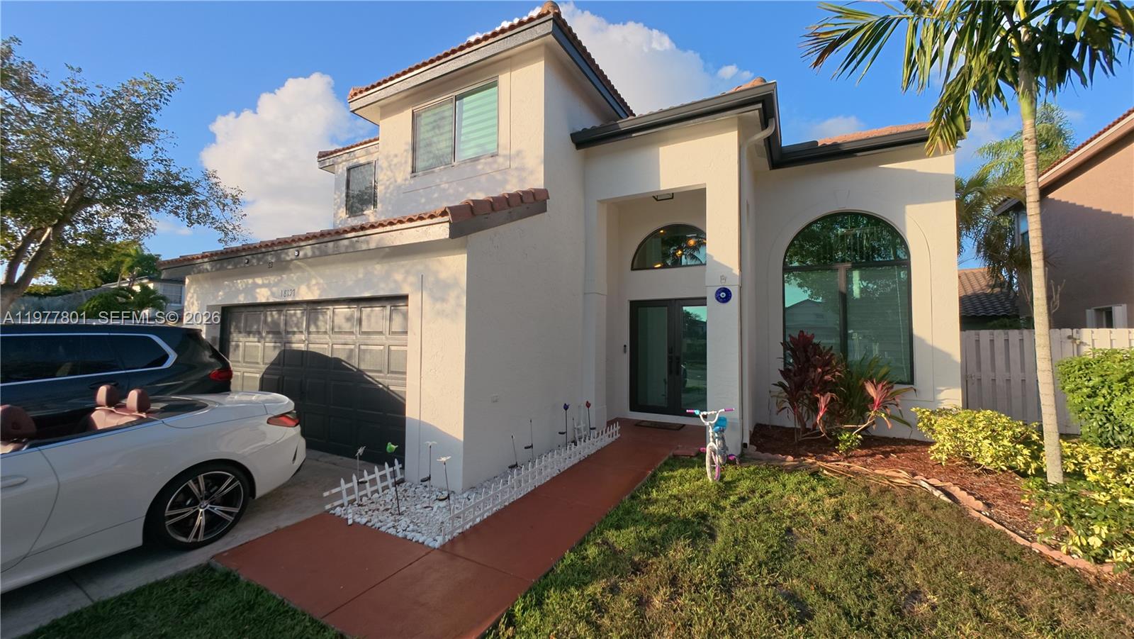 Beautifully maintained 4-bedroom residence located directly across from the community clubhouse and pool, offering 2,175 square feet of living space in a spacious two-story layout.

The home features an updated kitchen, large windows that fill the interior with natural light, and durable waterproof vinyl flooring throughout the first floor. The versatile fourth bedroom is incorporated within the primary suite and can easily serve as a home office, gym, nursery, or additional bedroom depending on the needs of the new owner.

Major systems have been well maintained, including an AC system replaced in 2019 and a water heater installed in 2021. Built with solid CBS construction and a flat tile roof.

The property offers a 2-car garage plus extended driveway parking, along with plenty of guest parking nearby.

Located in a family-friendly community with convenient access to shopping, schools, and major roads.

Originally recorded as a 4-bedroom home per tax records. A previous owner combined two bedrooms to create a larger room, and the home currently functions as a 3-bedroom layout.