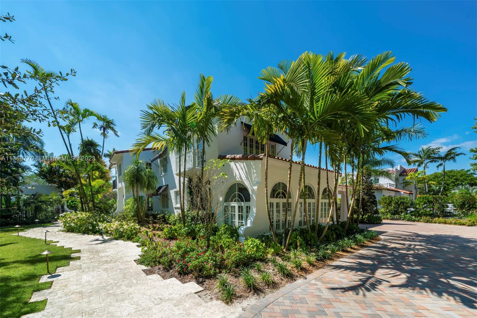 Luxurious landmark Mediterranean-style 6,168 SQ FT home in Coral Gables, with five bedrooms and eight full bathrooms. The grand entrance leads to a spacious living room with high ceilings and hardwood floors with a cozy fireplace, a gourmet kitchen with top-of-the-line appliances, and an expansive family room. The primary suite has a 2 private balconies with beautiful views, walk-in closet, and a spa-like bathroom. The outdoor area features a pool and spa, lush landscaping, and a covered terrace. With a prime location and classic design, this property is ideal for those seeking luxury living in Coral Gables. In close proximity to the finest dining, shopping, and schools.
