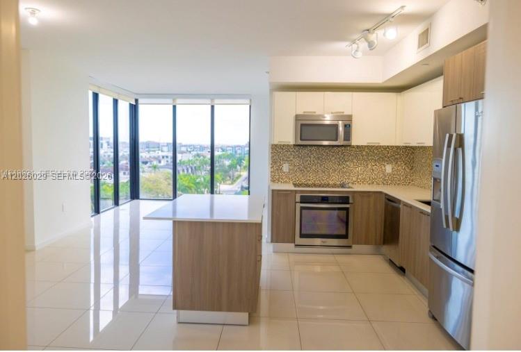 Modern and elegant 2BD/2BA residence in the desirable Downtown Doral area. Located on the 6th floor, this unit offers an open and functional split layout, spacious bedrooms, walk-in closets, and contemporary finishes. The stylish kitchen overlooks the city skyline and seamlessly connects to the living and dining areas, creating the perfect space for entertaining. Washer and dryer inside the unit.

Enjoy premium amenities including 24-hour concierge, valet service, resort-style pool, gym, spa, business center, and kids’ playroom. Walking distance to Downtown Doral shops, restaurants, supermarkets, and excellent schools. Option to rent furnished available. Unit may also be sold fully furnished. Please note: the unit does not include storage. Listed rental price of $3,500 is for the unit unfurnished.