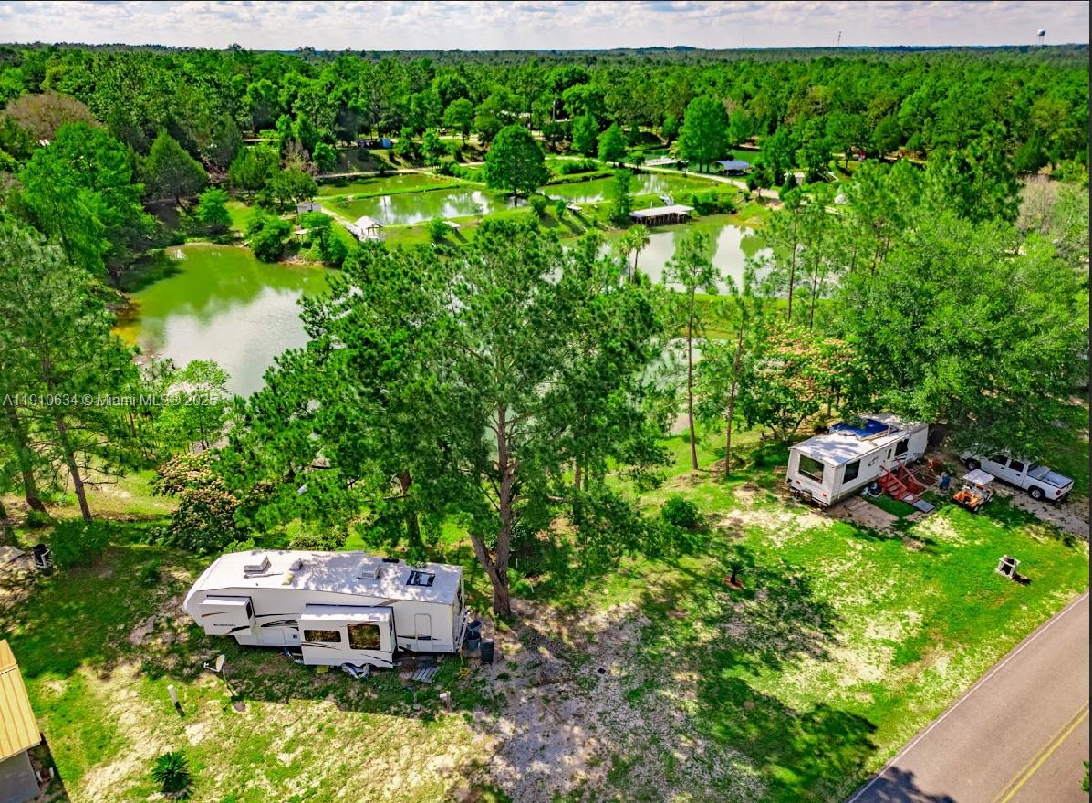 EXCELLENT OPPORTUNITY TO OWN AN RV PARK WITHIN 30 minutes distance to Florida's sugar sand beaches and world famous 30-A !! Precisely located in Walton County just an 1/8 of a mile from famous Beach Highway which is the main corridor into the Best Beaches that Florida has to offer! 
Don't miss this opportunity to buy this diamond in the rough 
It is an operating RV Park with room for growth and improvement 
There's two mobile homes plus a cottage, an apartment and many other buildings 
There are also three natural spring-fed fish ponds
Some of Florida’s most beautiful natural springs are only a short distance away! 
Owner financing is available! Don't miss this amazing opportunity