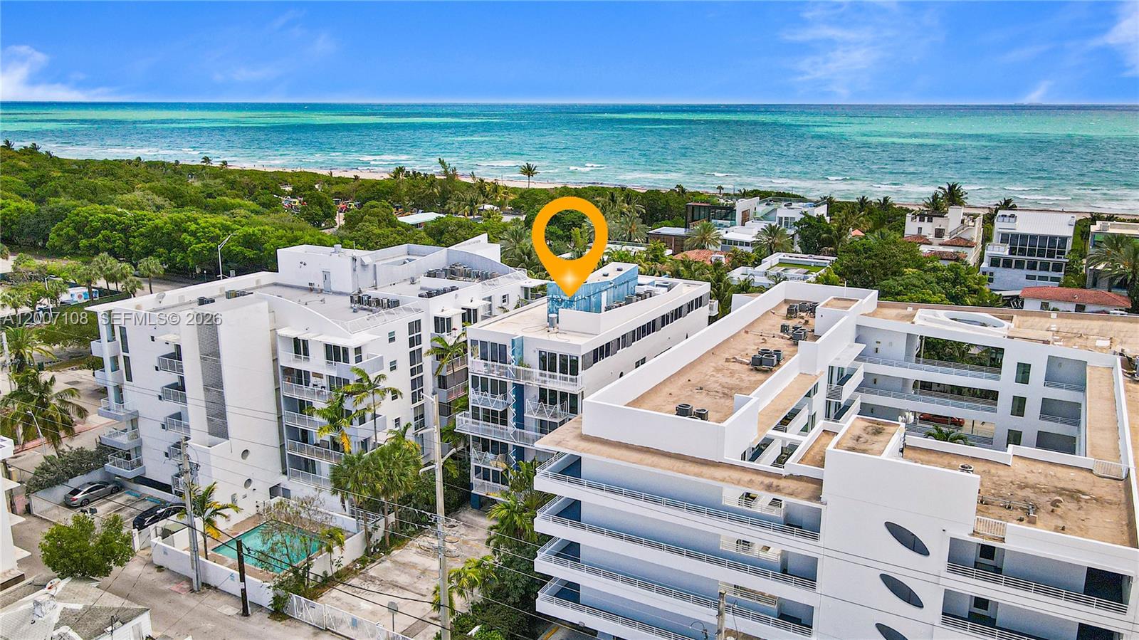 A rare and refined opportunity in Miami Beach's coveted North Beach. This stunning 2BR/2BA corner residence at boutique Collins Park — designed by the acclaimed Arquitectonica — offers 1,360 SF of sophisticated living just steps from the sand. only 2 residences per floor, privacy is paramount. Breathtaking views overlook the prestigious Altos del Mar community and the expansive 32-acre North Shore Oceanside Park.
Soaring natural light pours through impact windows and doors, illuminating exquisite marble floors that flow throughout. Two private balconies frame the best of Miami Beach — greet the sunrise with ocean breezes from the east-facing terrace, then unwind with glittering city and bay views as the sun sets to the west. At the heart of the home, a showstopping open concept kitchen dazzles with bespoke European cabinetry, granite countertops,  stainless steel appliances, integrated wine cooler, oversized peninsula and a designer statement vent hood.
Generous living and dining areas create an effortless flow for entertaining. The serene primary suite retreat offers a walk-in closet and luxurious en-suite bath. A thoughtful split-bedroom layout accommodates guests, family or a private home office with ease. In-unit laundry and covered parking.
Steps to the Beach, Bandshell, North Beach's finest dining and boutiques, Minutes to Bal Harbour, Surfside & Sunny Isles Beach. Space, privacy and timeless style — perfectly positioned. A MUST SEE!!!