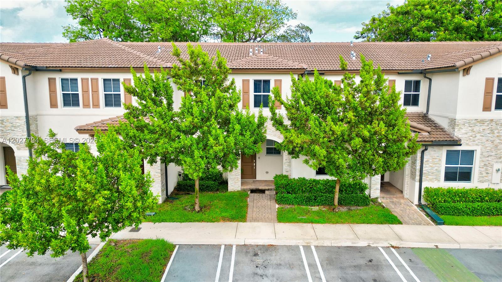 Come and discover a peaceful, bright, and beautiful community where you'll find this charming, welcoming townhouse with everything you need to enjoy a comfortable lifestyle. Welcome to the gated Westview North community—a neighborhood that perfectly combines tranquility with convenient access to city life. Are you looking for an affordable, family-friendly, and pet-friendly community in Miami? After a long day at work, enjoy a relaxing walk through the beautifully landscaped green spaces or unwind with a refreshing swim in the pristine resort-style pool. The amenities in this community are truly exceptional, featuring a dog park, children's playground, fitness center, pet park, and a stunning clubhouse with 24/7 access. Safety and peace of mind come standard with 24/7 security, a gated entrance, and dedicated security patrols. BUY YOUR FIRST HOME WITH ZERO MONEY — ASK HOW! Down payment and closing cost assistance programs are available for qualified buyers. This home offers outstanding comfort with spacious living areas, an open-concept layout, and a gorgeous private fenced backyard overlooking lush greenery.  The elegant white kitchen features stainless steel appliances, modern countertops, and plenty of storage space. Upstairs, you'll find comfortable bedrooms and a large walk-in closet in the primary suite. Enjoy high-impact windows and doors throughout the home. Ideally located within the community, the home is just a short walk from the resort-style amenities.