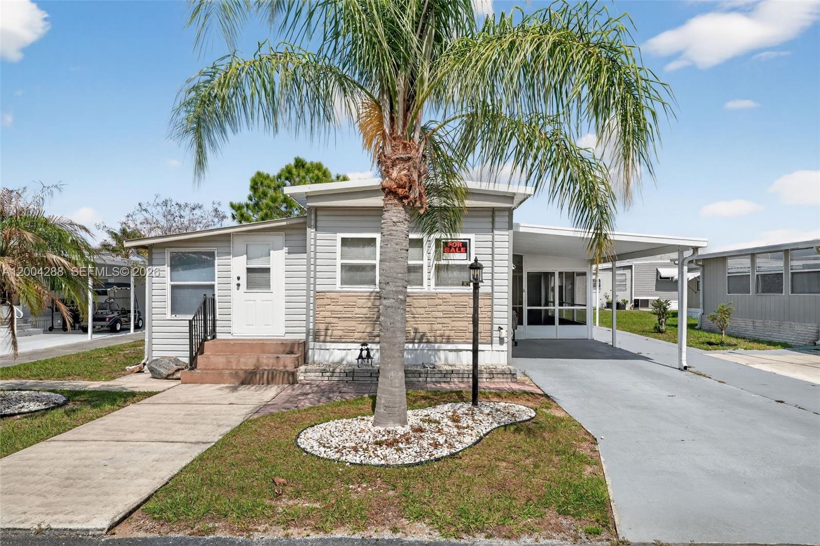 Welcome to easy Florida living in Haines City, just minutes from Disney! Located in a friendly 55+ community, this well-maintained home is move-in ready with a brand-new kitchen and updated flooring. Enjoy a carport, shed, and covered awning perfect for relaxing outdoors. Land is included, a rare find, with low lot rent and low share fee. The HOA offers great amenities, including a pool and more, for an active lifestyle. Lovingly maintained location, great for a large family gathering. Perfect as a seasonal getaway or full-time home in a prime Central Florida location!