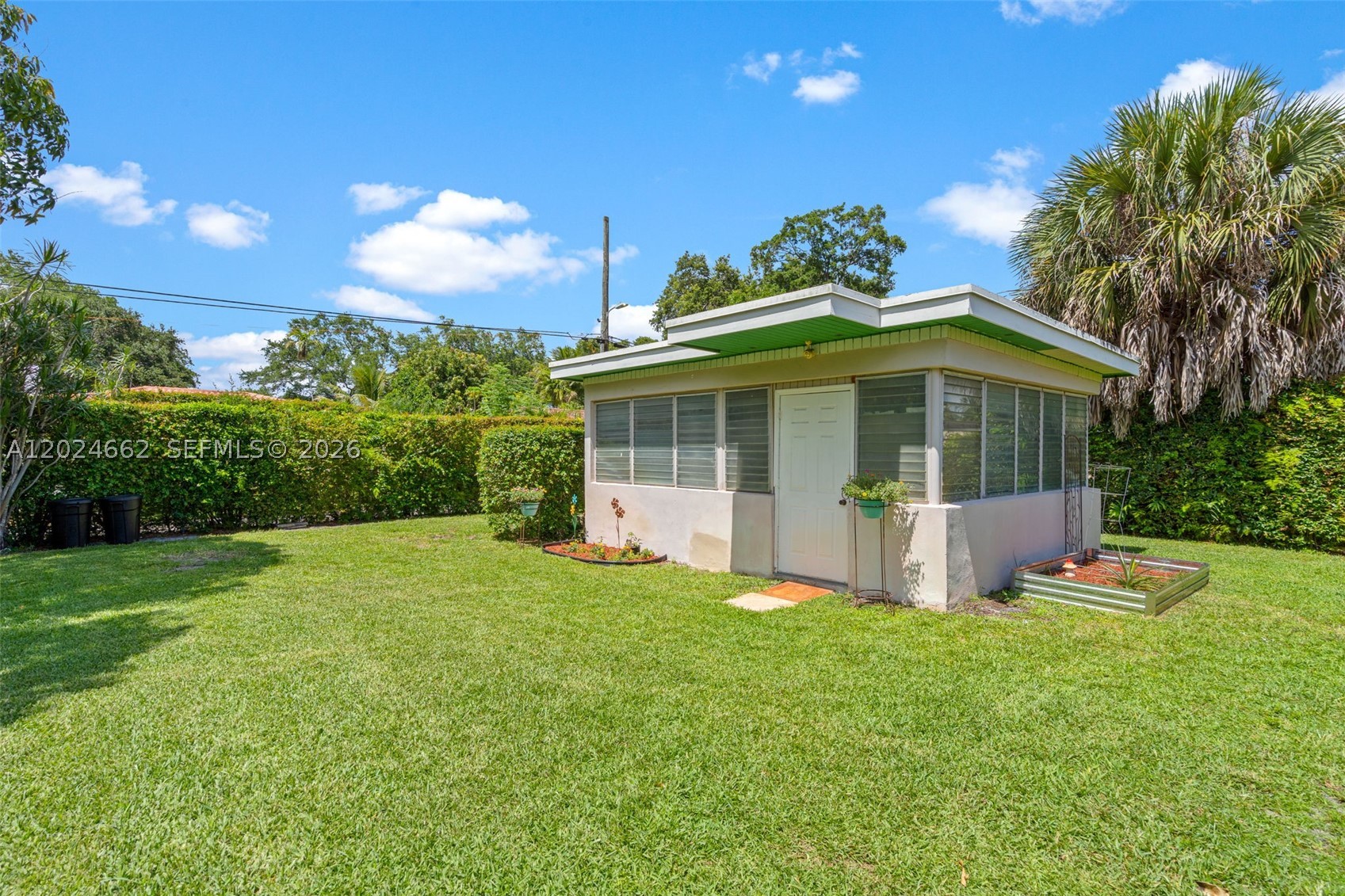 Unique opportunity in the prestigious community of Miami Shores! Currently the only property on the market offering 1,887 sqft of living area with versatile and highly desirable spaces designed for comfort and functionality. This beautifully maintained home features two additional living areas: one can easily be converted into an income-producing bedroom or guest suite, while the detached space is perfect for a gym, yoga studio, office, or creative retreat. This detached room includes electricity and its own wall A/C unit.
The seller has carefully prepared and maintained this home for the next owners to truly enjoy comfort and convenience. The spacious backyard offers enough room to build a pool and includes fruit trees such as mango, star fruit, and pineapple, creating a tropical and relaxing atmosphere. Property also has alleyway access and ample parking in both the front and rear of the home.
The primary bathroom was renovated less than one year ago. Hurricane windows and shutters throughout, including the family room, provide additional protection and peace of mind. The property also features well water for the sprinkler system, creating significant savings on water consumption.
Excellent location in one of Miami’s most desirable neighborhoods, surrounded by green areas, top-rated public and private schools, and just minutes from Barry University, shopping, dining, and major highways.