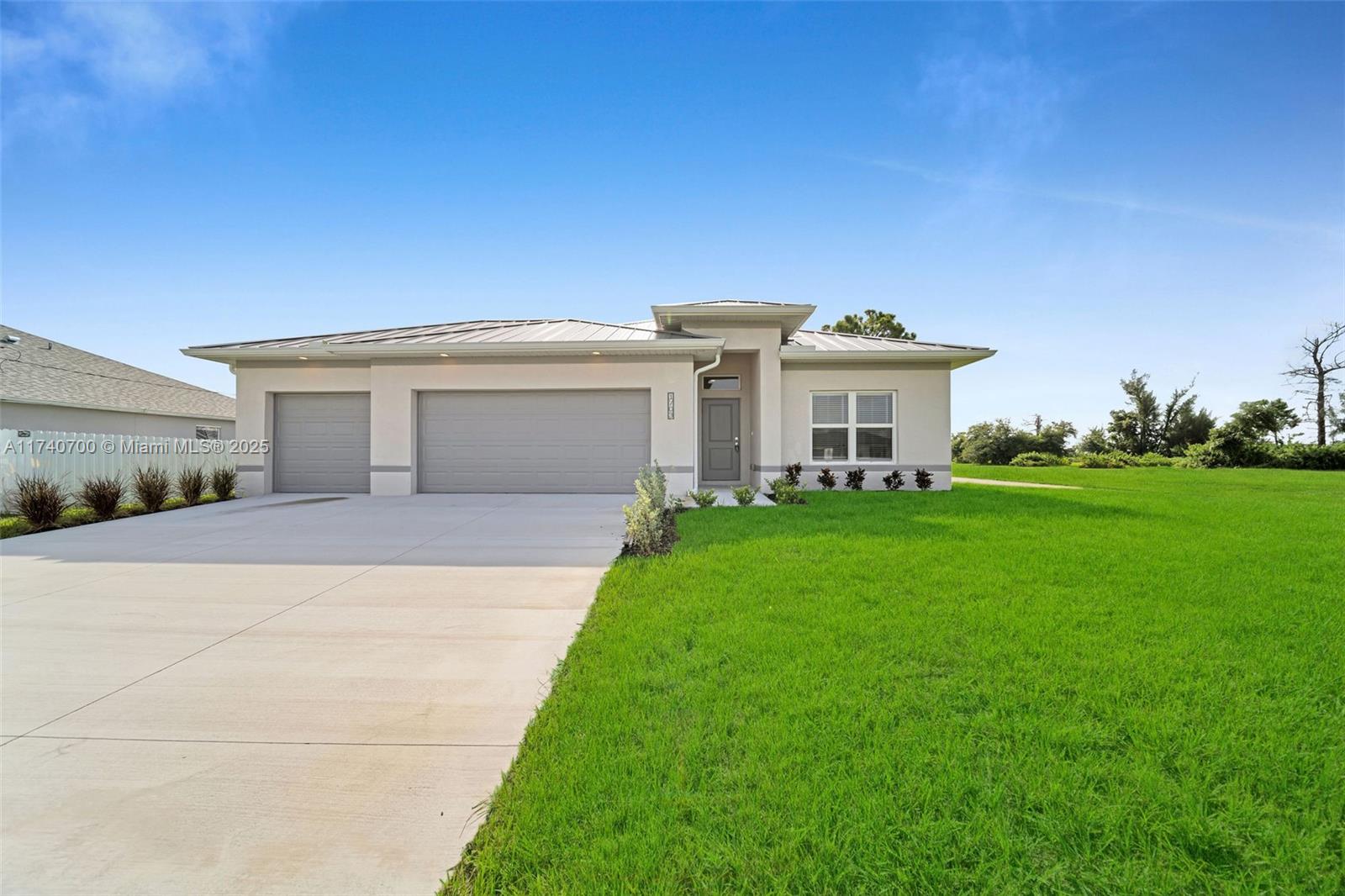 15,000 towards closing cost.BEST PRICED 4 BEDROOM 3 CAR GARAGE HOME IN CAPE CORAL! BEAUTIFUL NEIGHBORHOOD! REVERSE OSMOSIS THROUGHOUT ENTIRE HOUSE! This new construction home features 4-bedrooms, 2-bathrooms, and an individual laundry room (Washer & Dryer included) bathrooms feature custom granite countertops, tiled walk-in showers, and MB HAS double vanities! The entire home has a Reverse Osmosis filtration system. The kitchen features beautiful granite countertops, all new stainless steel appliances, 42 inch cabinetS This beautifully designed property also features a large 3-car garage. Peace of mind with the security of a metal roof with a 50 year warranty. Impact resistant windows & doors all throughout the property. Builder offering 2-10 home warranty .  NOT IN A FLOOD ZONE, NO HOA.