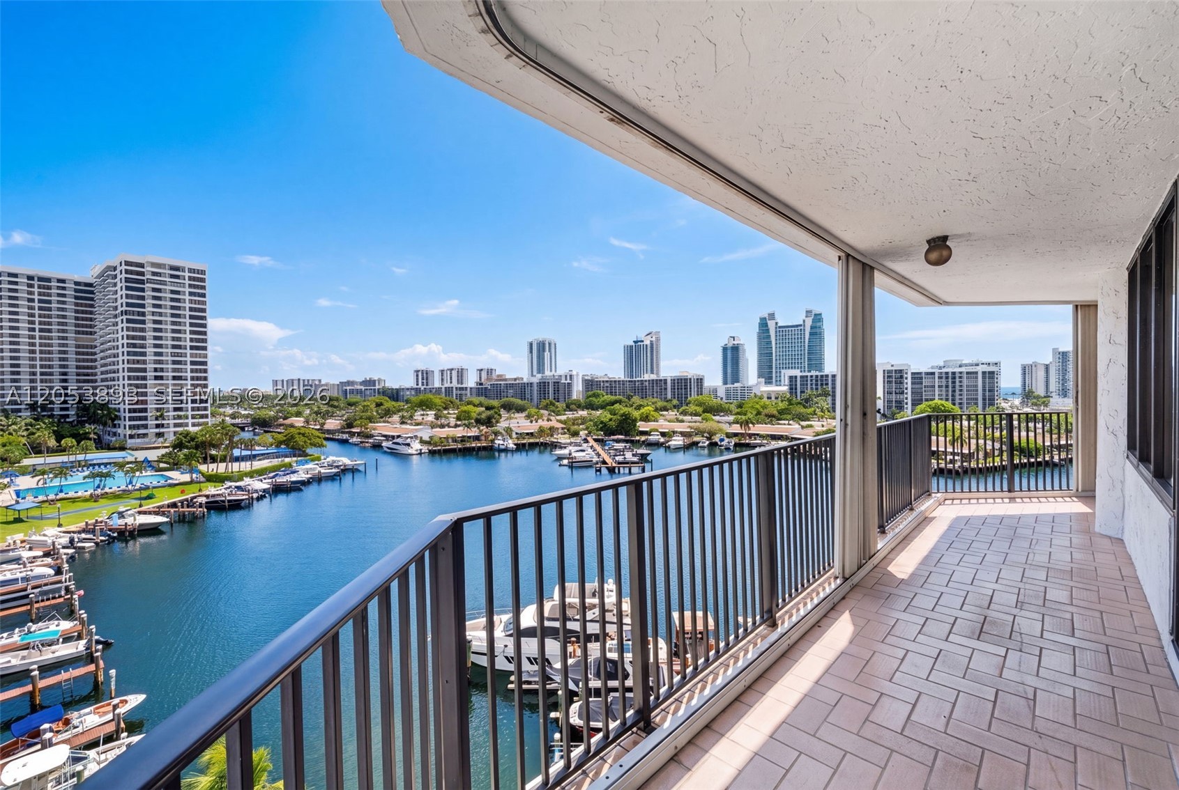BEST BUY in Anchor Bay Club !! This spacious (1692 sq ft) 7th floor waterfront unit features abundant natural light, generous closet space, WASHER and DRYER IN UNIT, and a TWO private balconies perfect for enjoying the South Florida lifestyle. The split-bedroom floor plan offers privacy for owners and guests alike. Well-maintained ( 40 year nearly complete)  building with resort-style amenities including a heated pool, fitness center, clubhouse, tennis courts, and 24-hour security. Ideally located just minutes from the beach, Gulfstream Park, Aventura Mall, restaurants, shopping, parks, marinas, and major highways. Perfect as a primary residence, seasonal retreat, or investment opportunity. Easy to show. Price includes one covered parking spot and one uncovered, an additional covered spot can be purchased for an additional 35000. Storage unit also available for 35000. Marina slips often available for sale or rent. 40 year assessment has been paid in full.