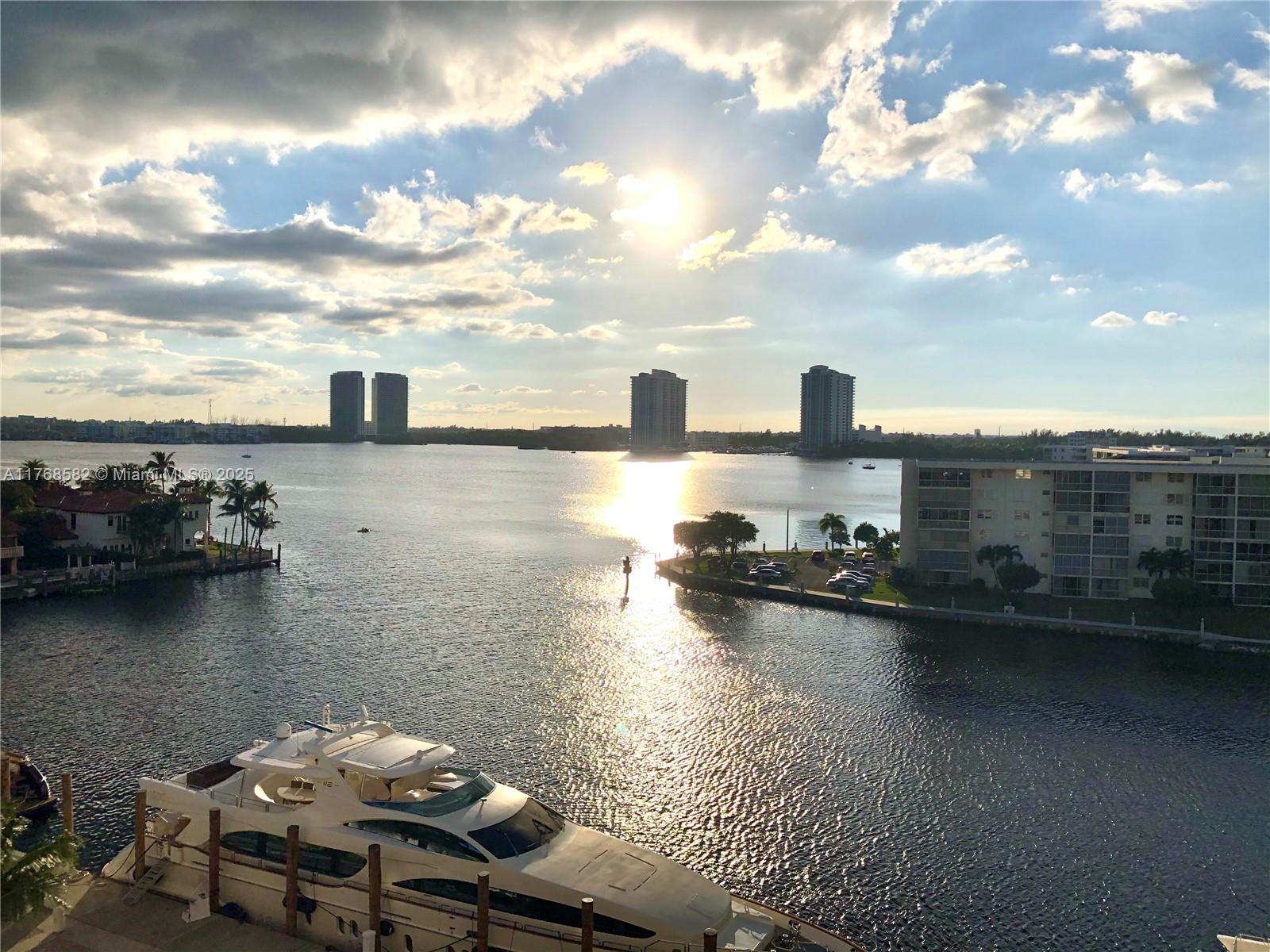BEAUTIFUL LAKE VIEWS FROM THIS 2 BEDROOM 2 BATH UNIT. STONE FLOORS THROUGHOUT. LIVE IN PRESTIGIOUS WILLIAMS ISLAND WITH FULL AMENITIES: 27,000 SQ FT STATE-OF-THE ART SPA, 16 TENNIS COURTS, 3 RESTAURANTS, WALK/JOG PATH, KIDS PLAYGROUND, DOGGIE PARK, COURTESY BUS, MARINA, AND SO MUCH MORE..
