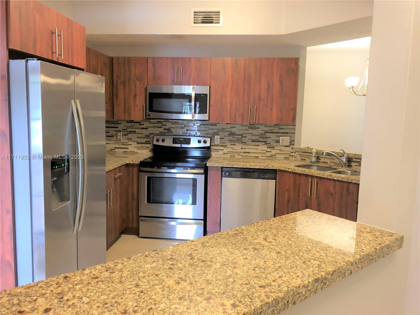 Beautifully updated 2/2 lake view, first floor condo in Guard Gated Golf Community of Grand Palms centrally located near I75 and various shopping, restaurants, and entertainment. Laundry room conveniently located in the unit with full-size washer and dryer. The owner says No pets allowed.